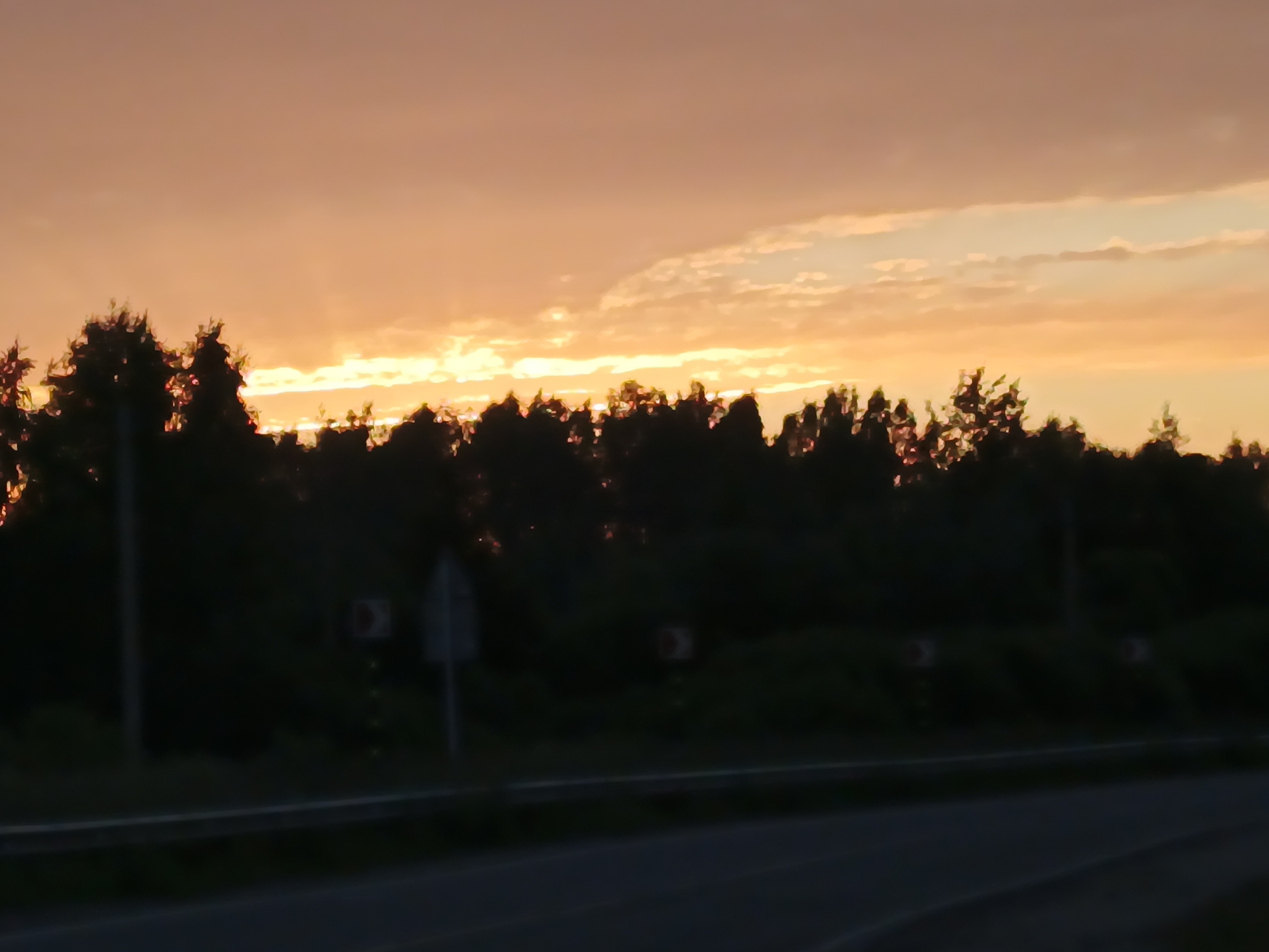 Sunset over rural roads and cell towers near Воскресенское