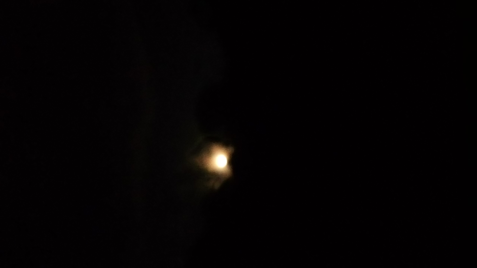 Moon partially obscured by clouds observed in Ndeiya, Kenya