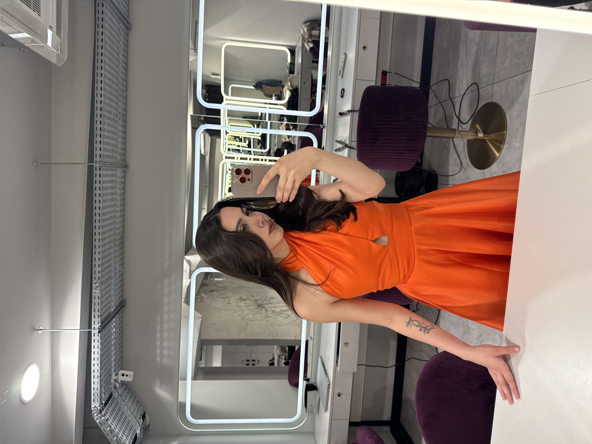 Woman takes mirror selfie in Yerevan beauty salon