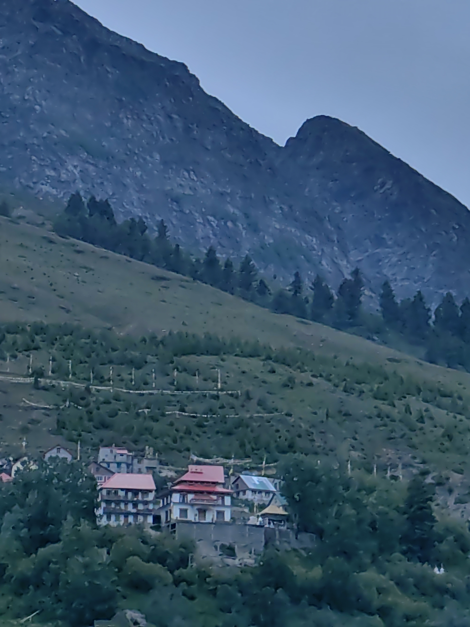 Keylong hillside town life, stupas, prayer flags, and mountain views