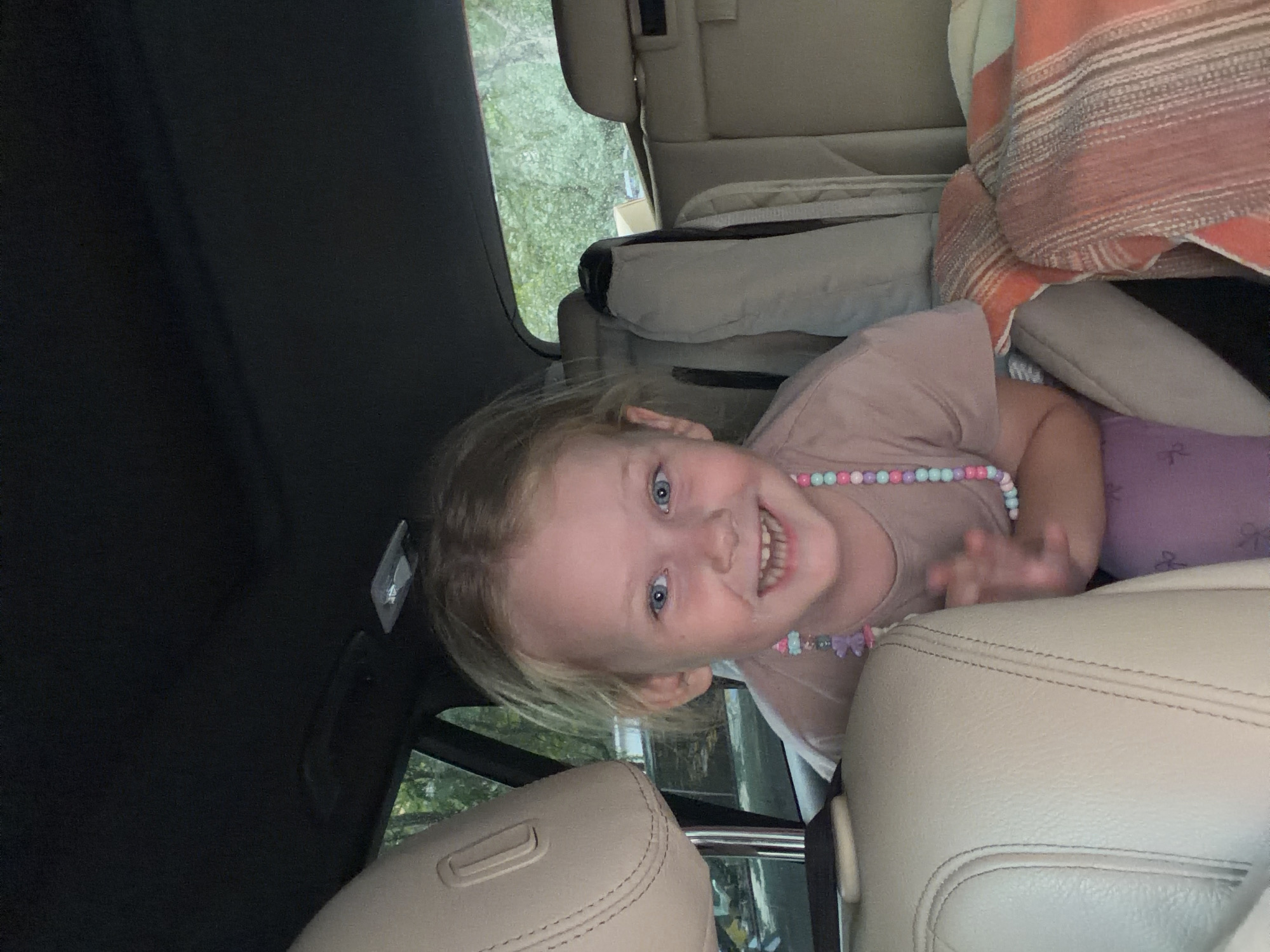 Girl and parrot share car ride in Moscow