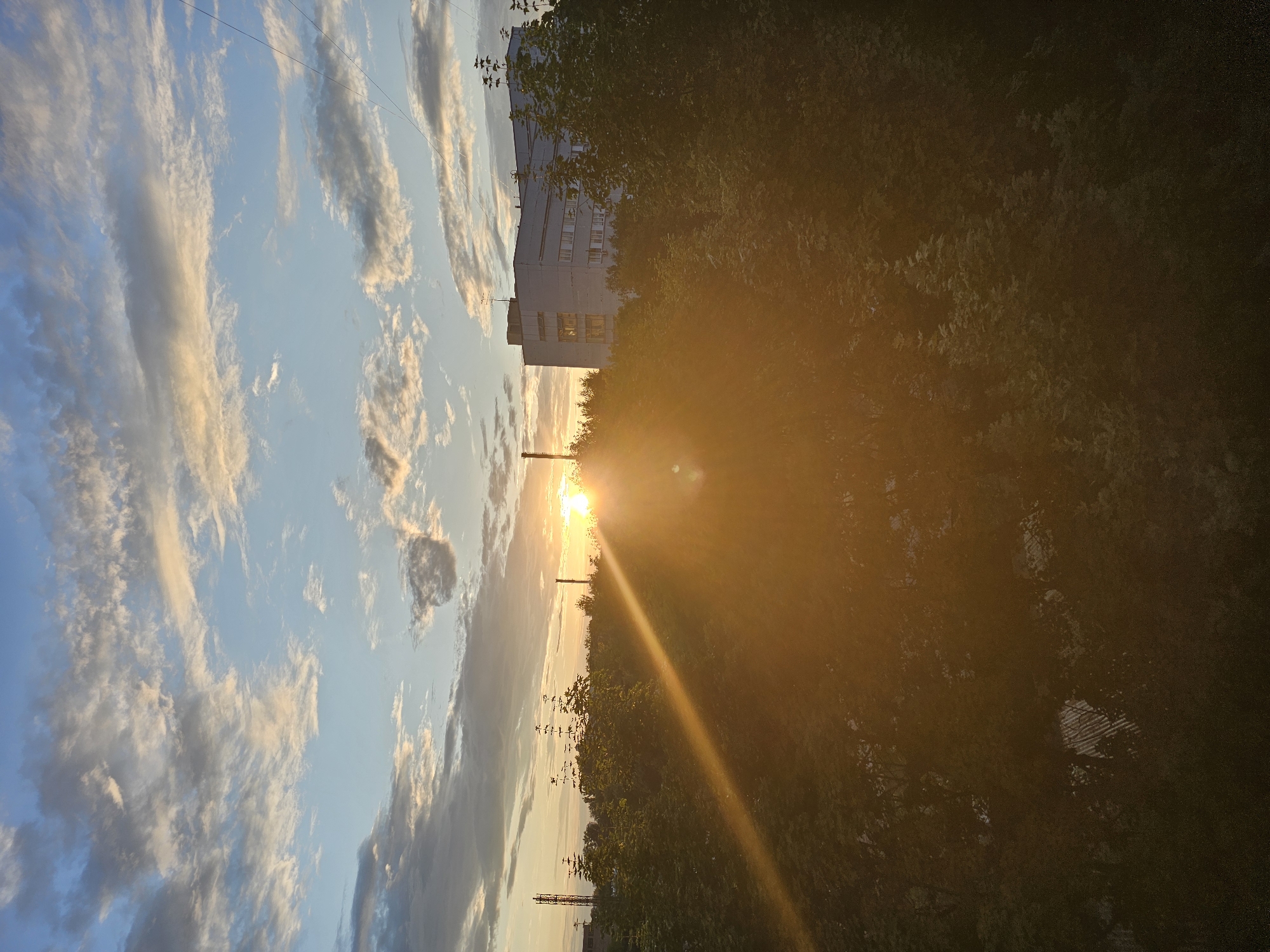 Golden sunset hangs low over Khimki's city skyline