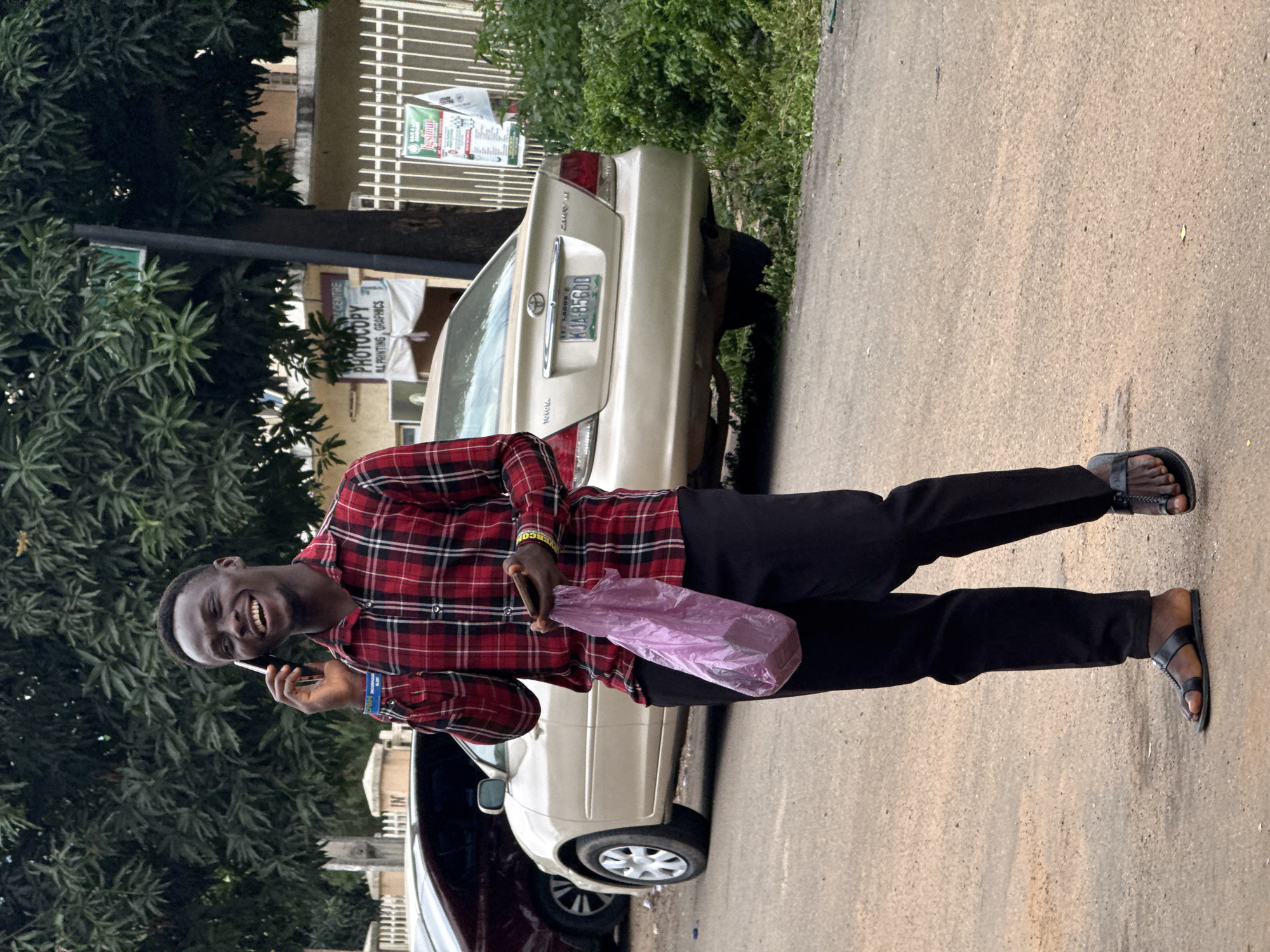 Street life near an Abuja transport hub, mid-morning