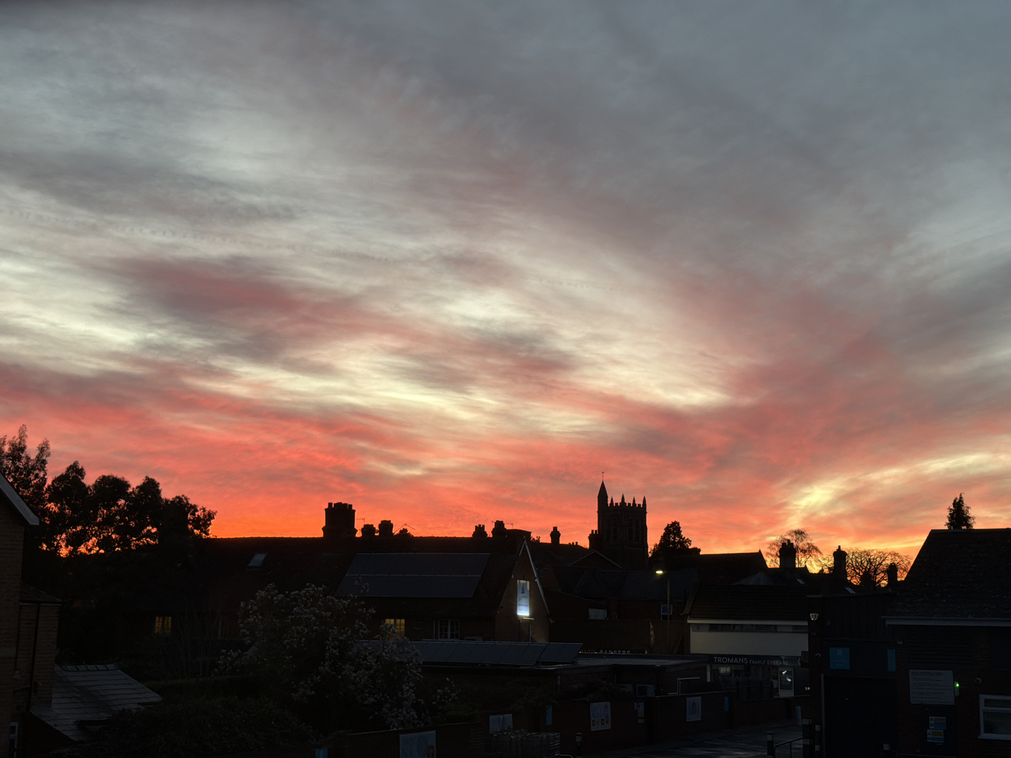 Sunset captured over Malvern Hills townscape with vibrant colors