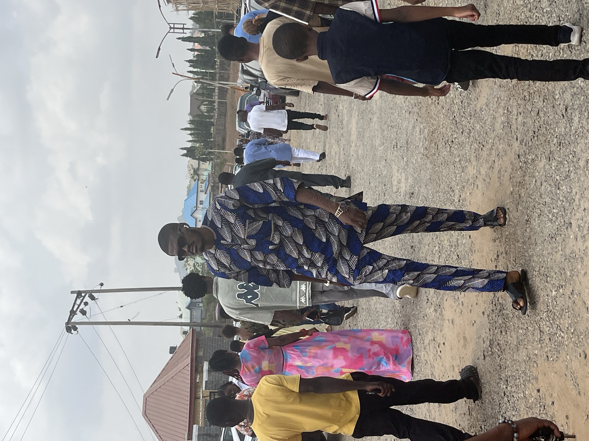 Morning street life and church gathering documented across Abuja