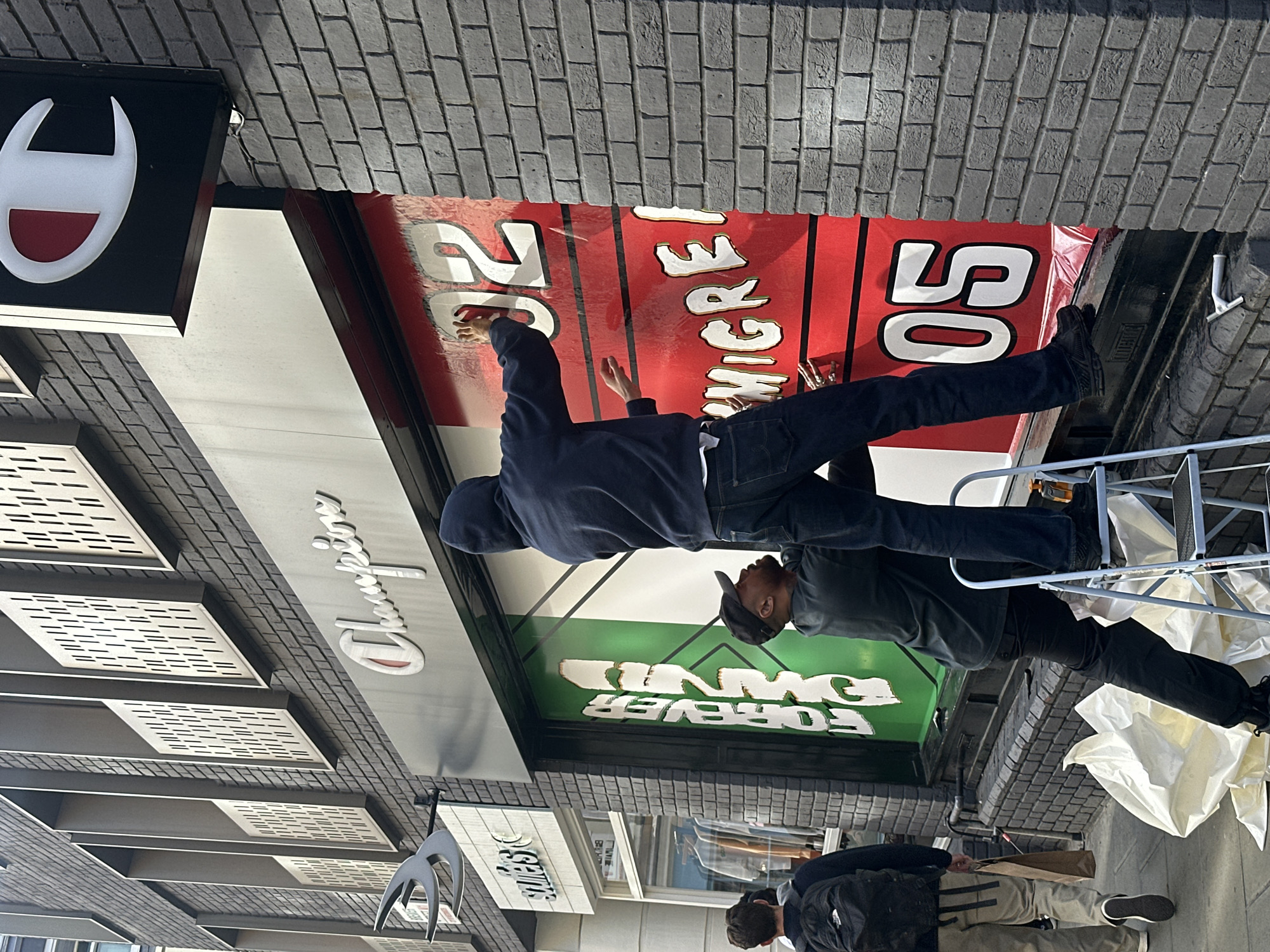 Workers Install Storefront Banner in London