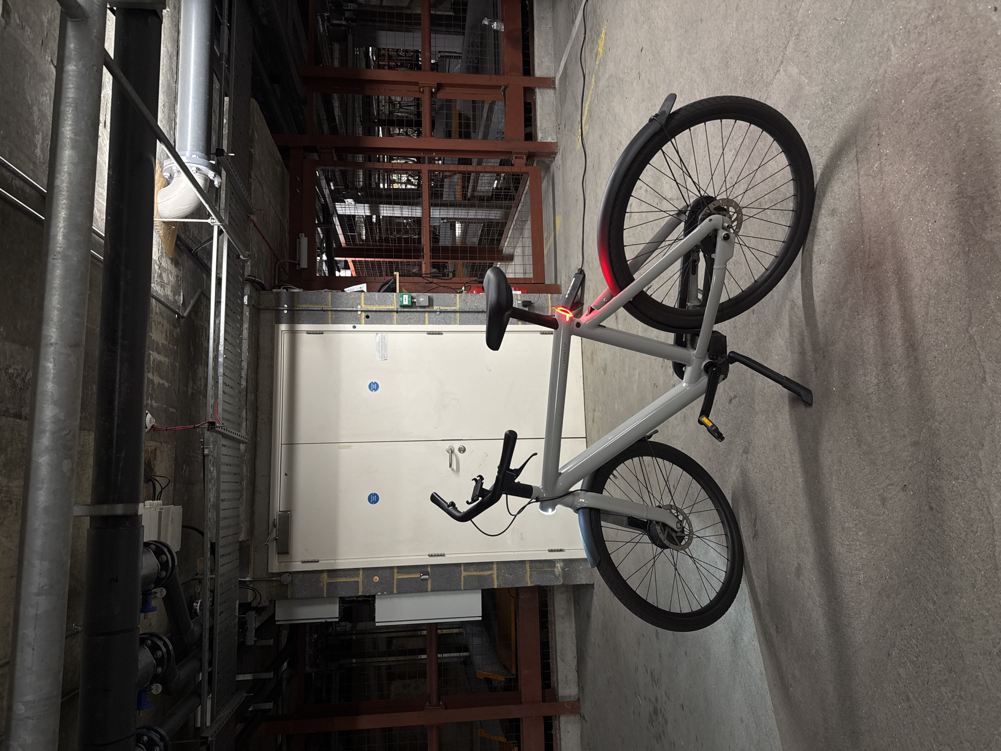 VanMoof electric bike charging in London industrial setting