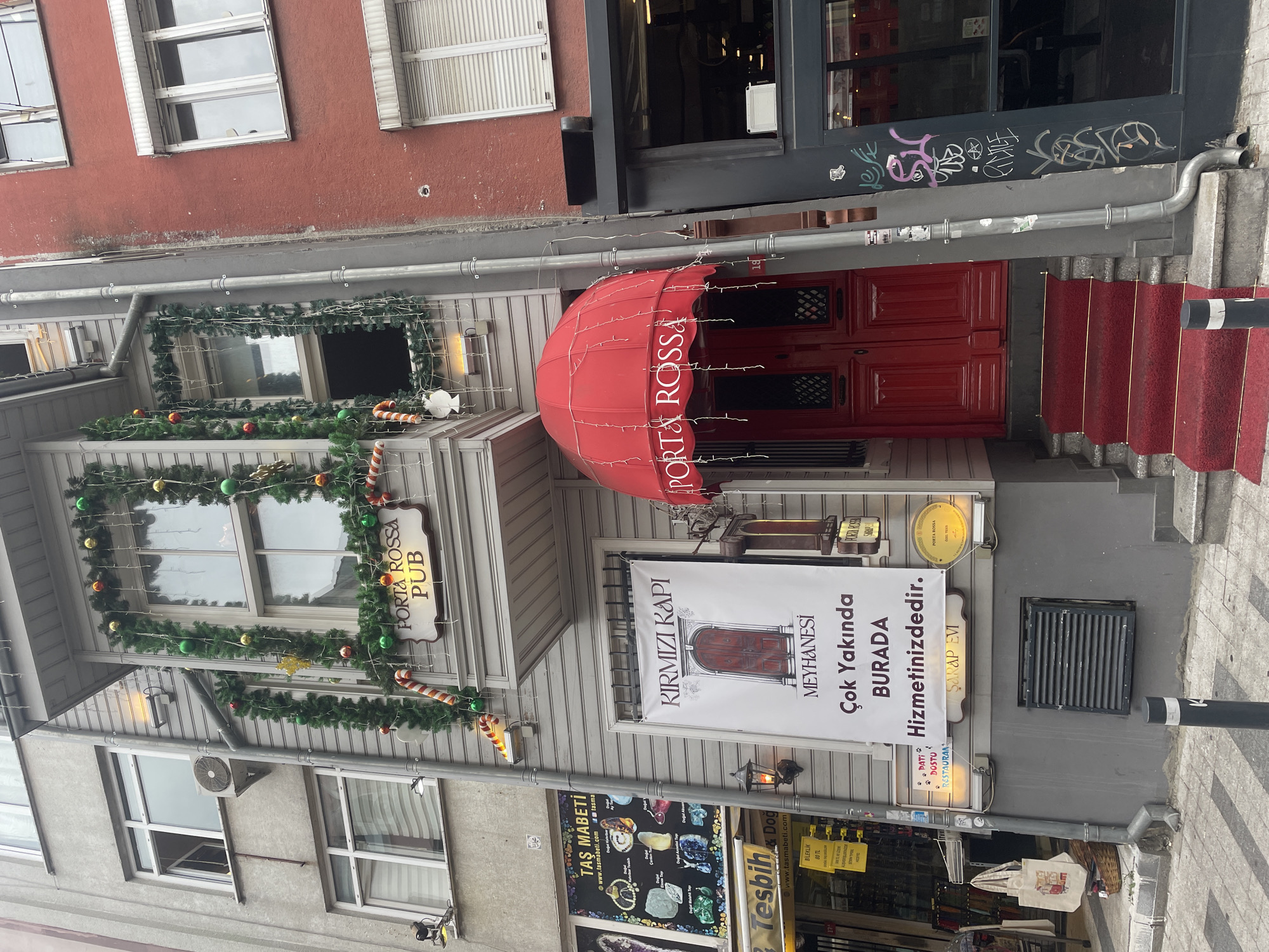 Street-level Kadıköy: shops, tram tracks, and colorful decor