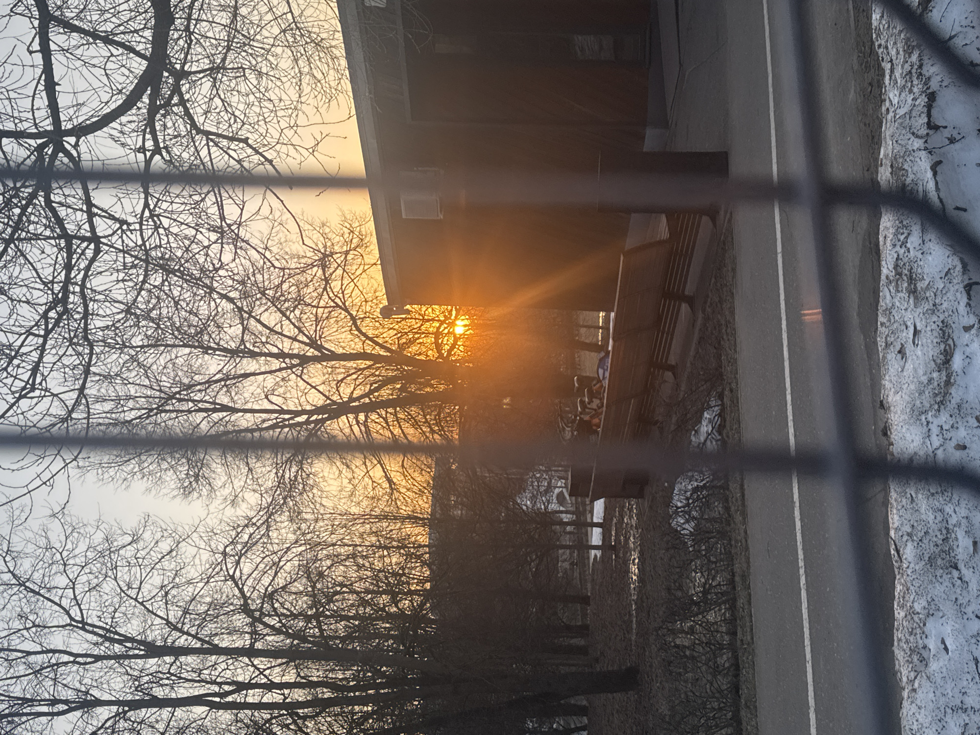 Late afternoon sun illuminates Moscow cityscape through window