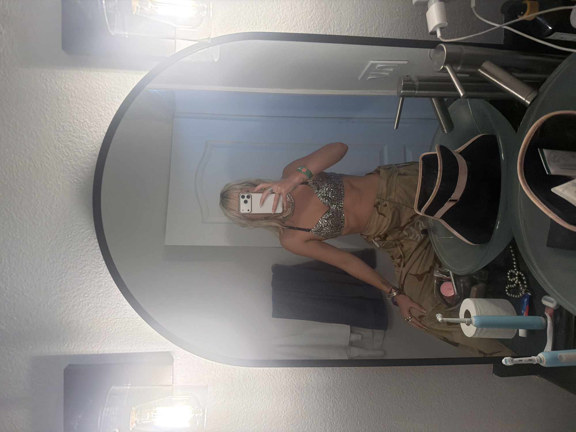 Woman takes mirror selfie in Palm Desert bathroom