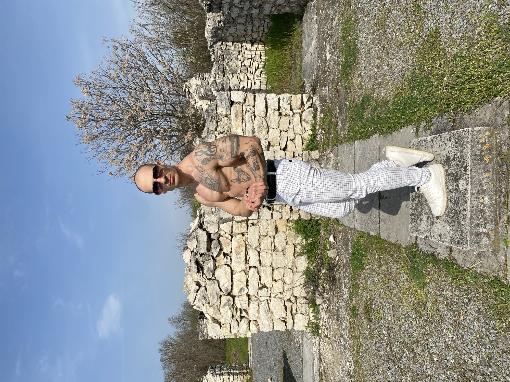 Tattooed man poses for photos in sunny Pleven morning