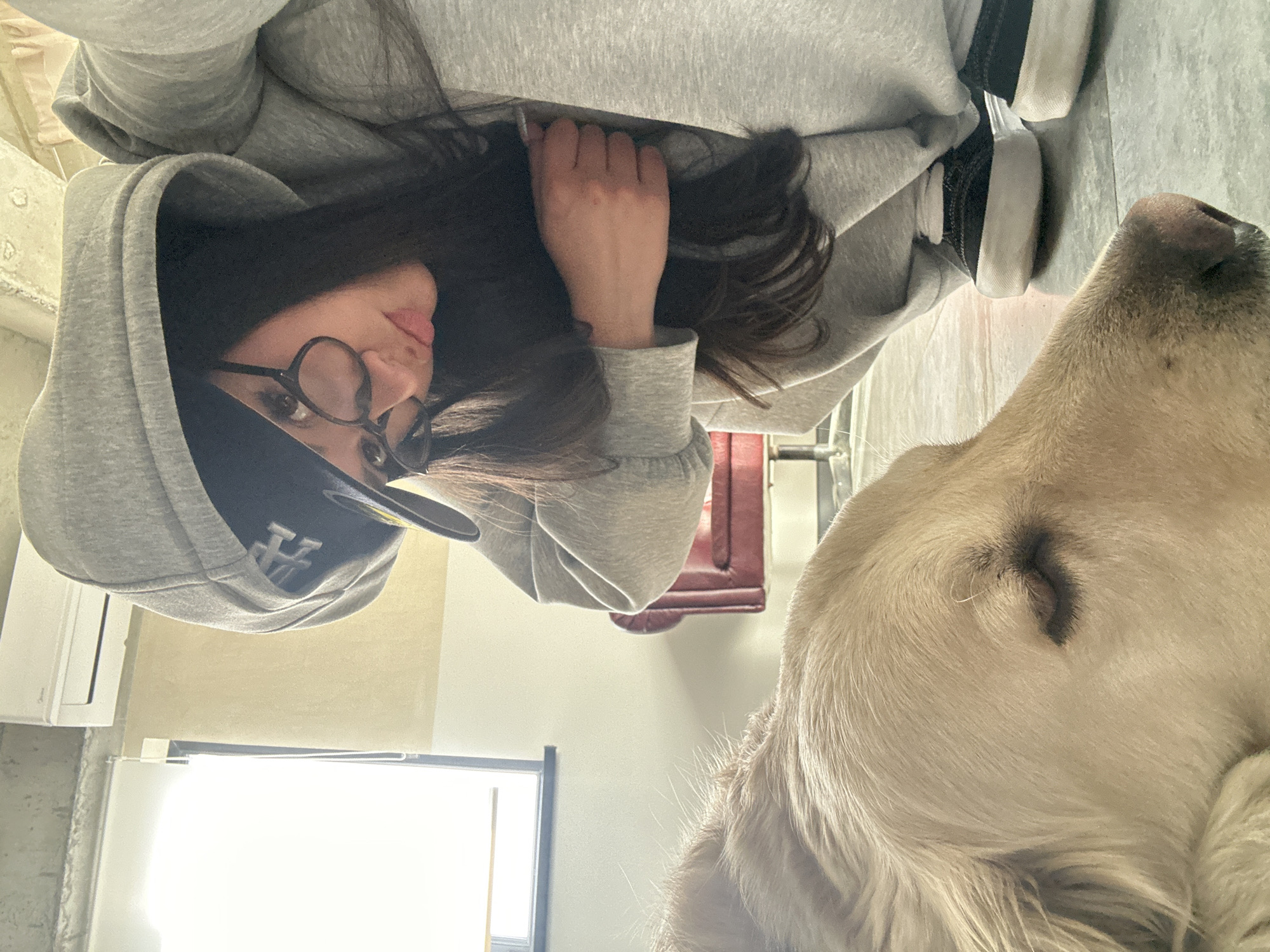 Person and golden retriever documented in casual indoor moments, Armenia