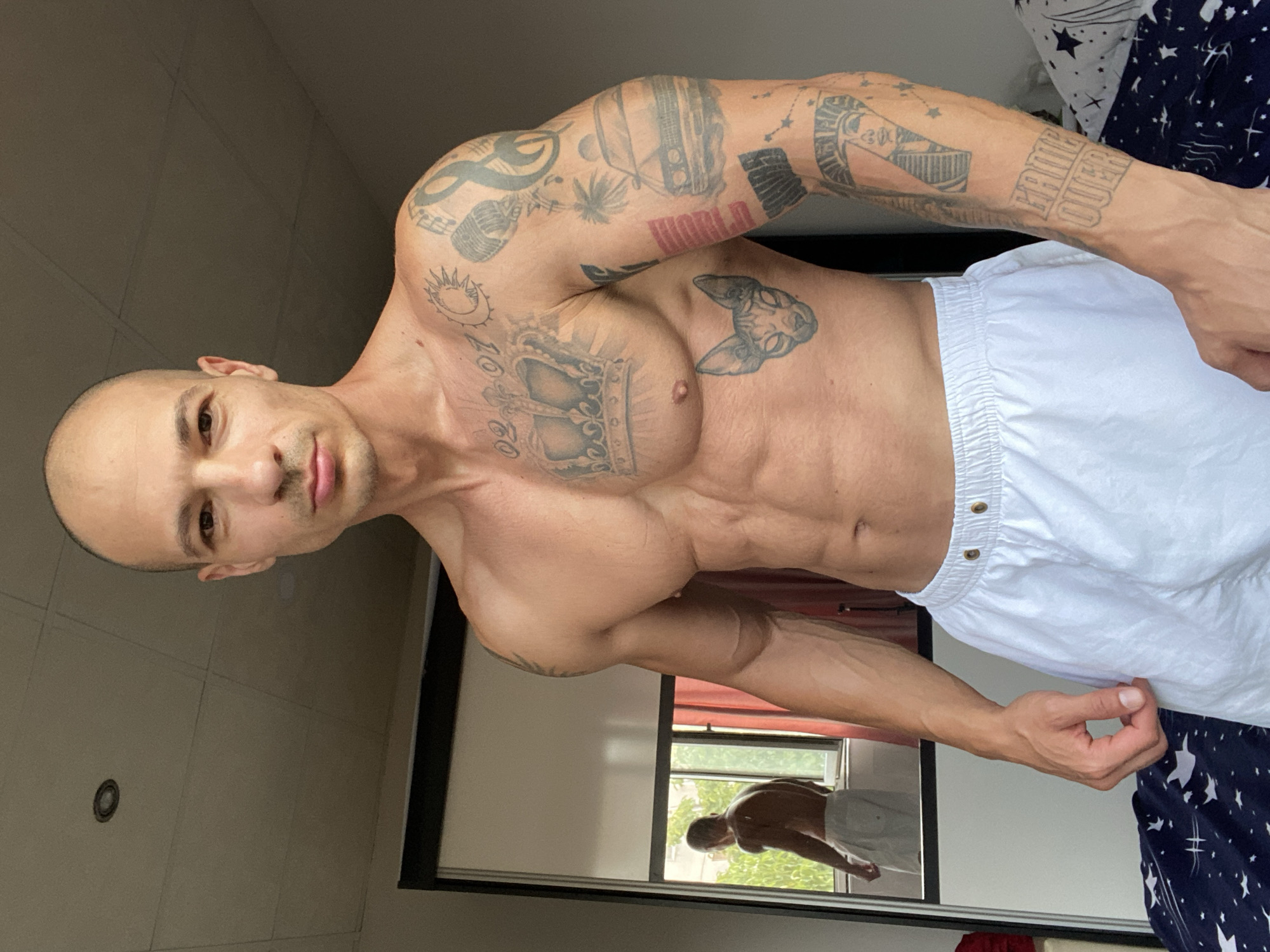 Tattooed figure, two looks, one room in Pleven