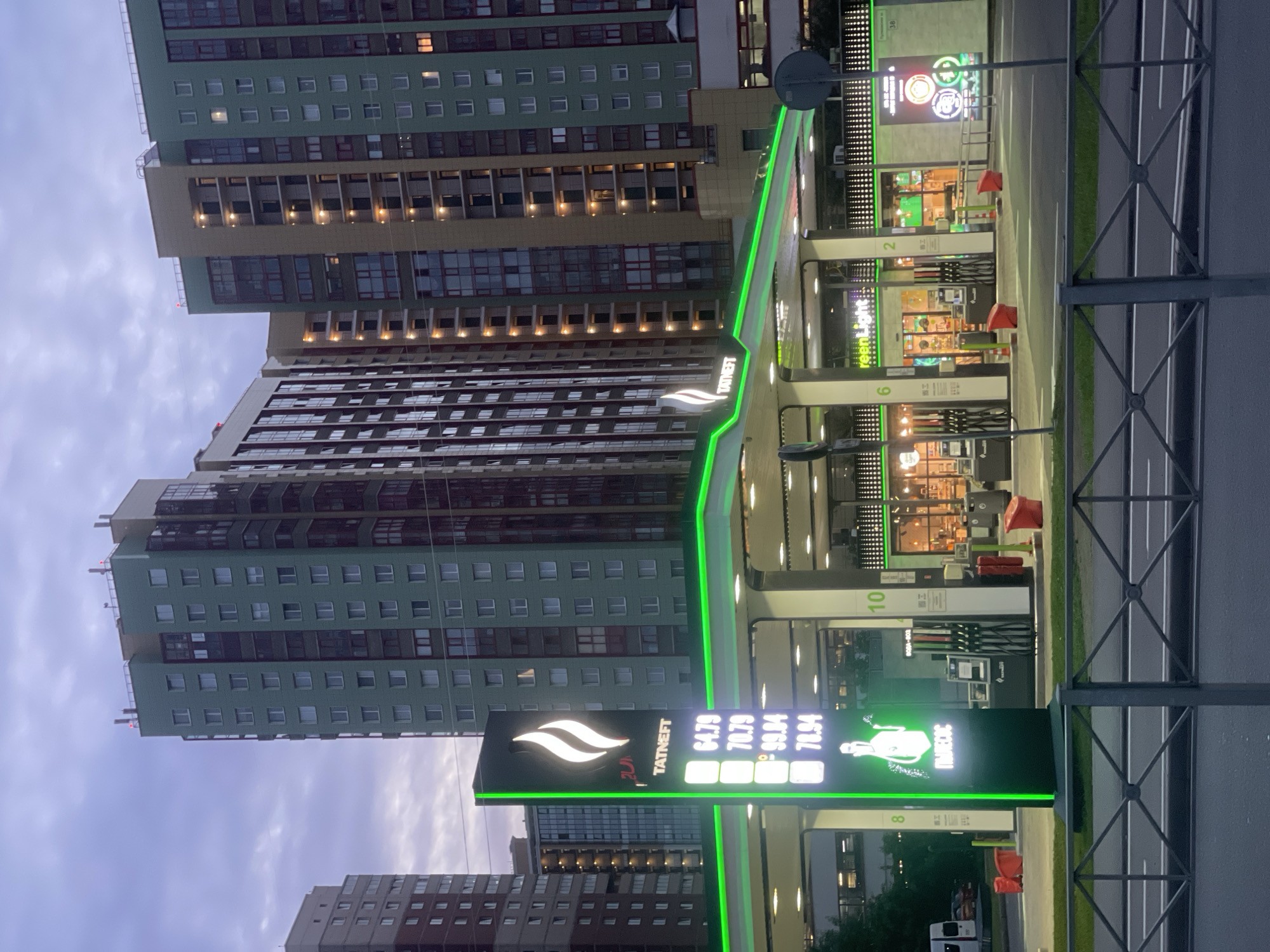 Auto dealership and city scenes at dusk, Russia