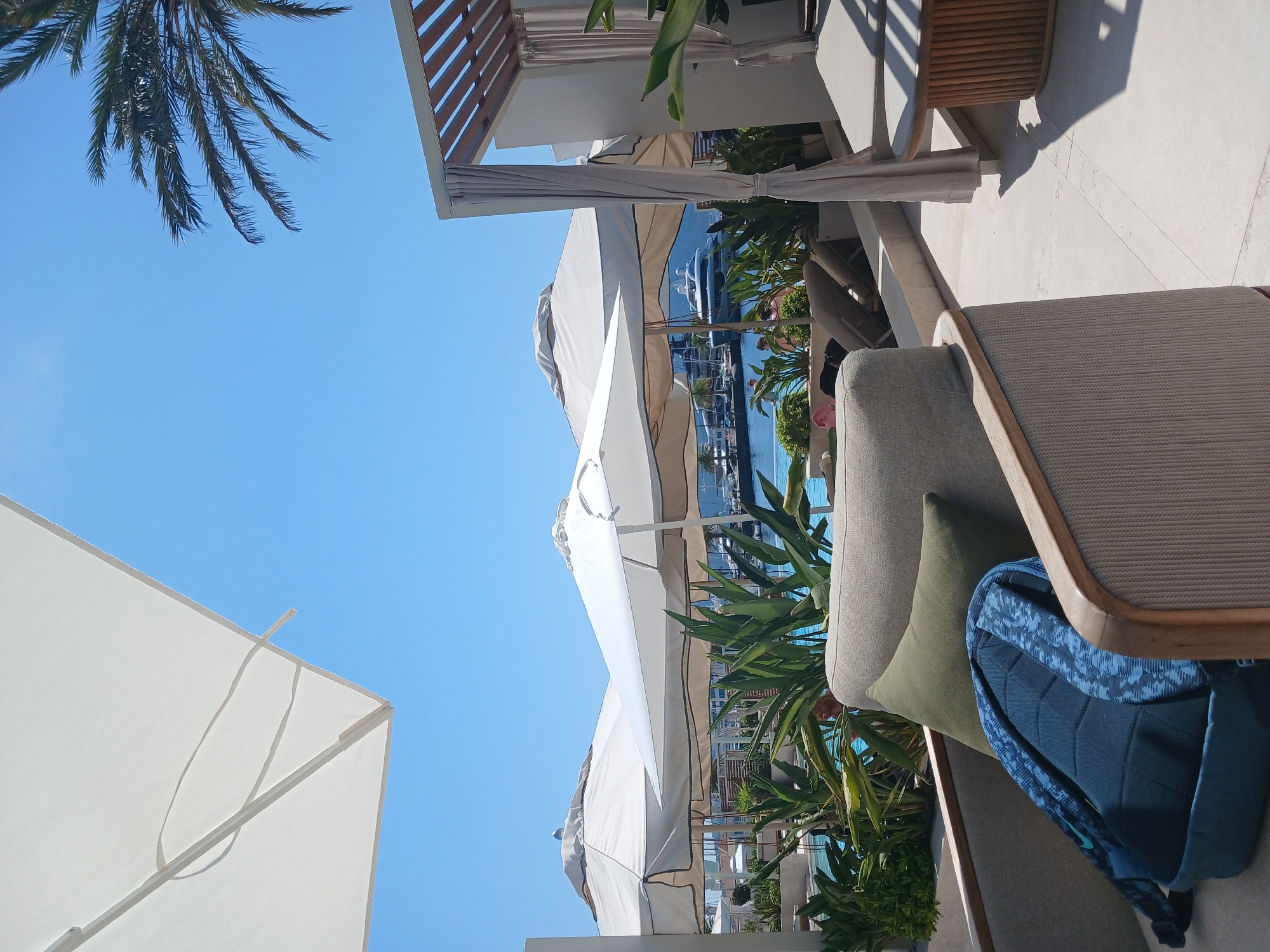 Poolside sushi and selfies at a marina-view venue