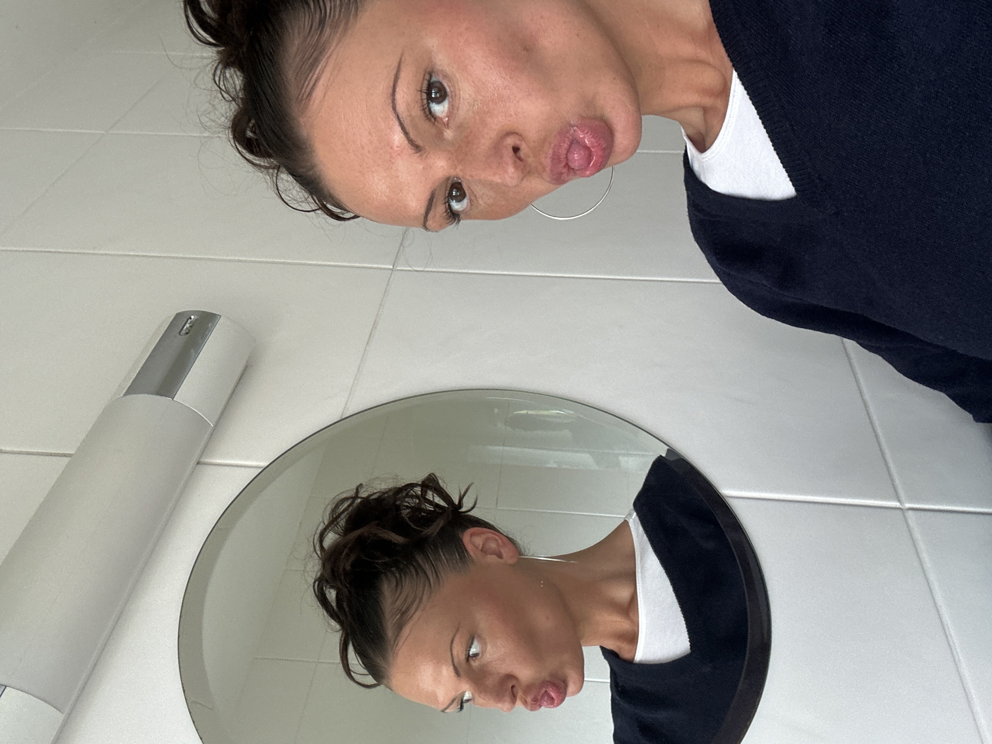 Woman takes playful bathroom selfies in Wealden, UK