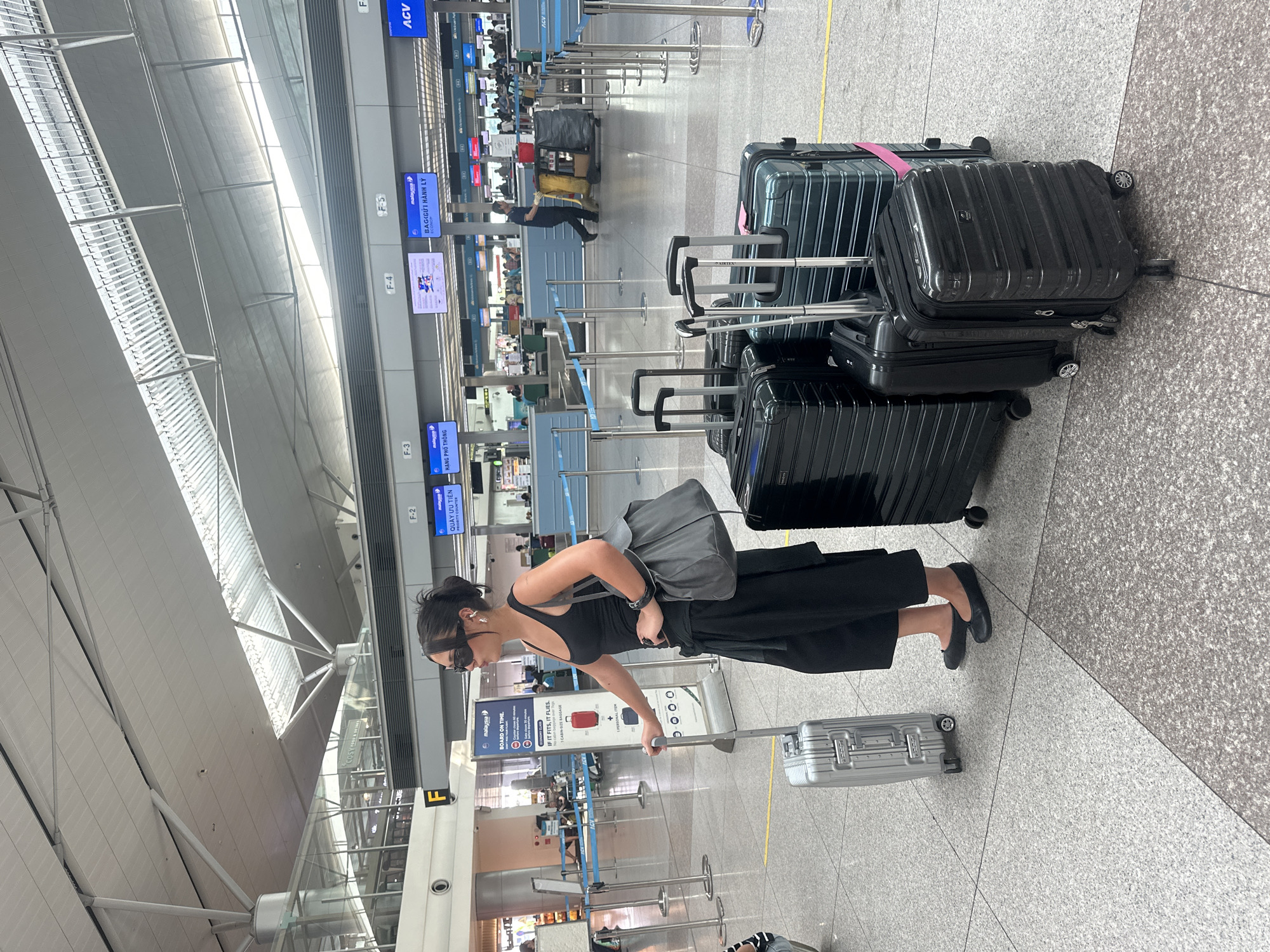 Woman with suitcase spotted at Thuận An airport