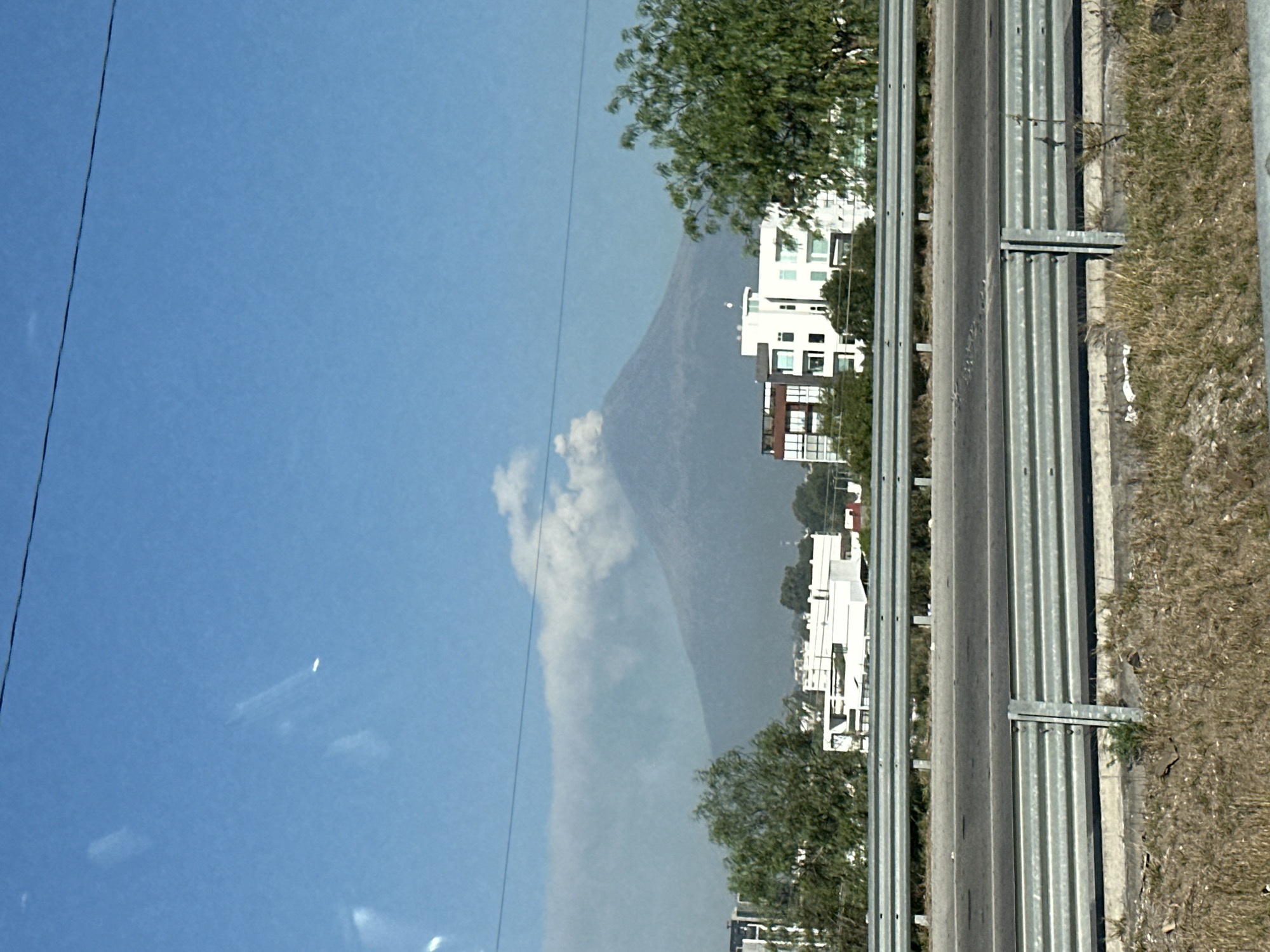 Highway scene with mountain backdrop observed in Mexico