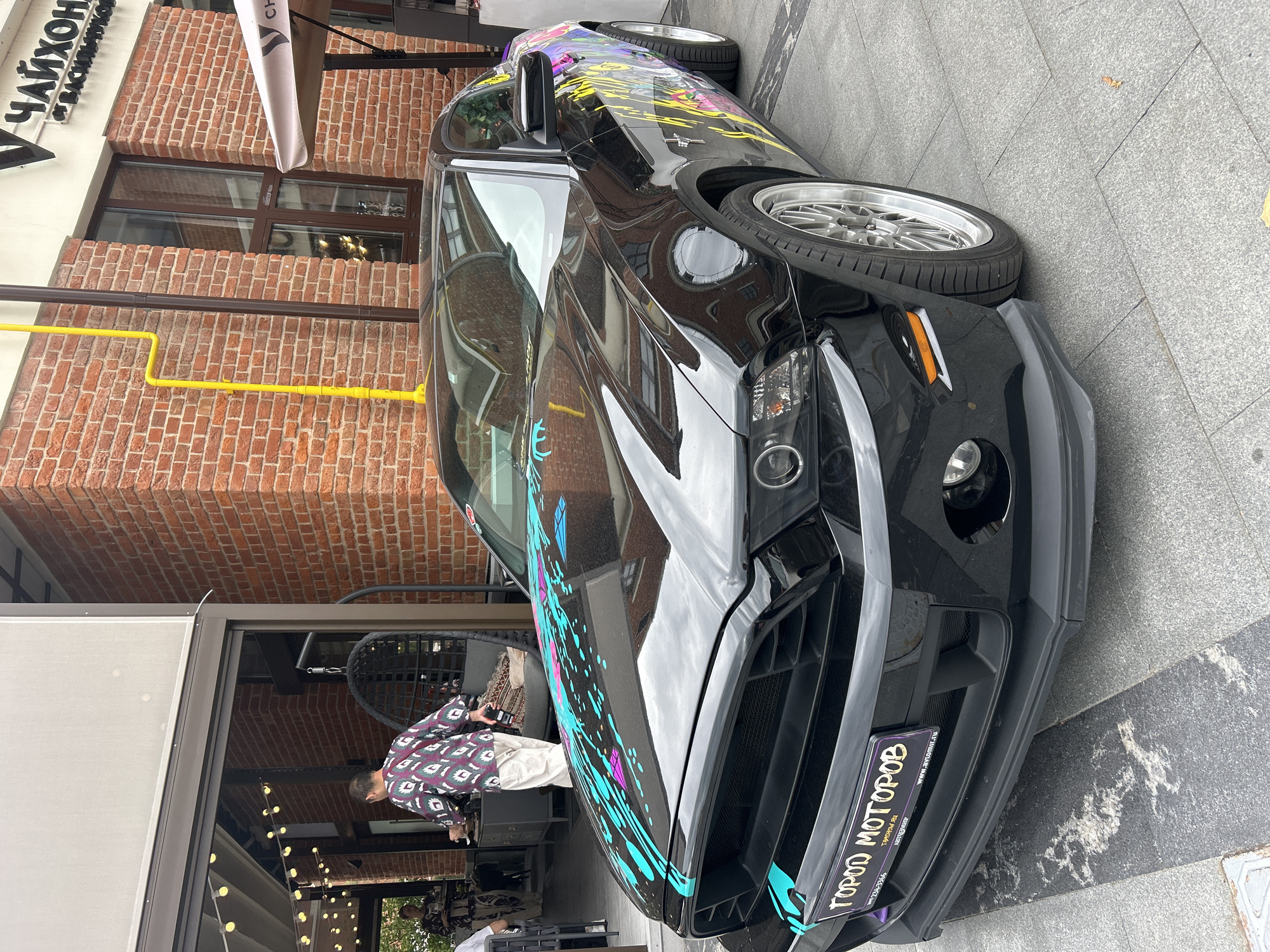 Eclectic car meet on a Moscow plaza, classics and customs out