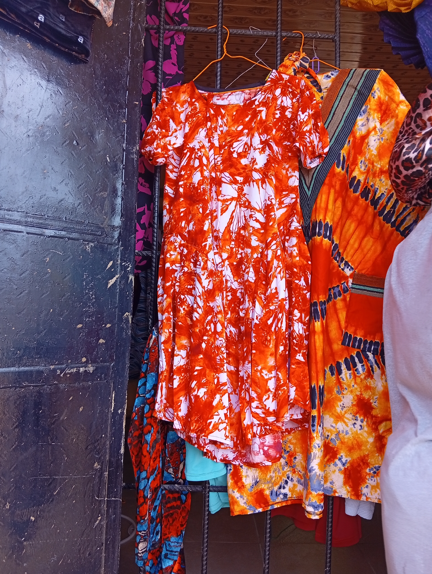 Street vendors display colorful clothing in Owerri, Nigeria