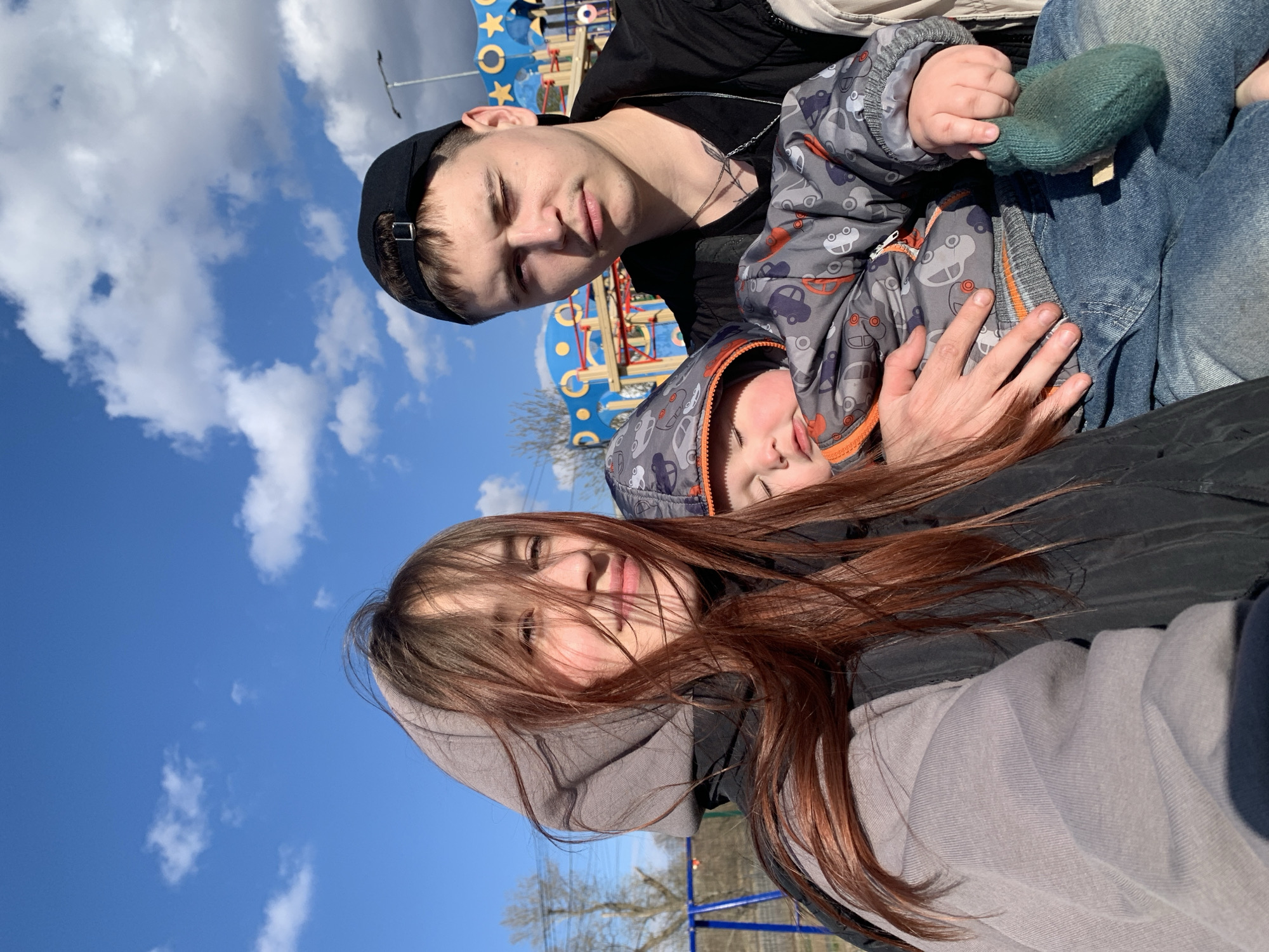 Family enjoys sunny playground visit in Фоки, Russia