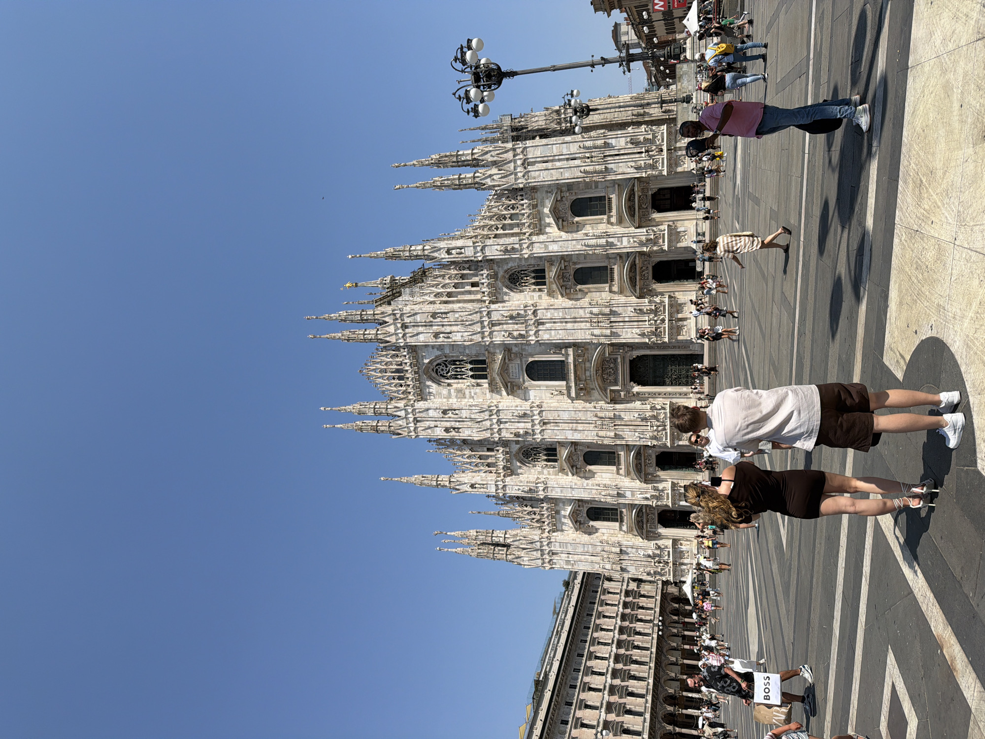 Milan's Duomo gleams under a bright summer sky