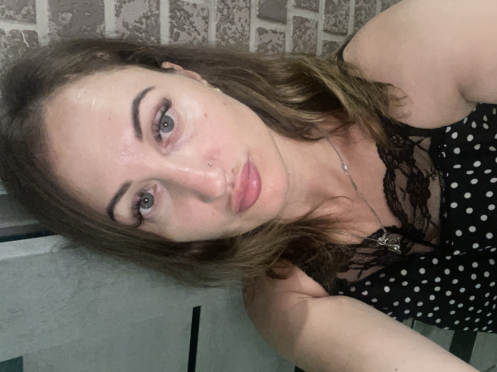 Selfie portrait in Zarichne, Ukraine, polka dot top and silver necklace