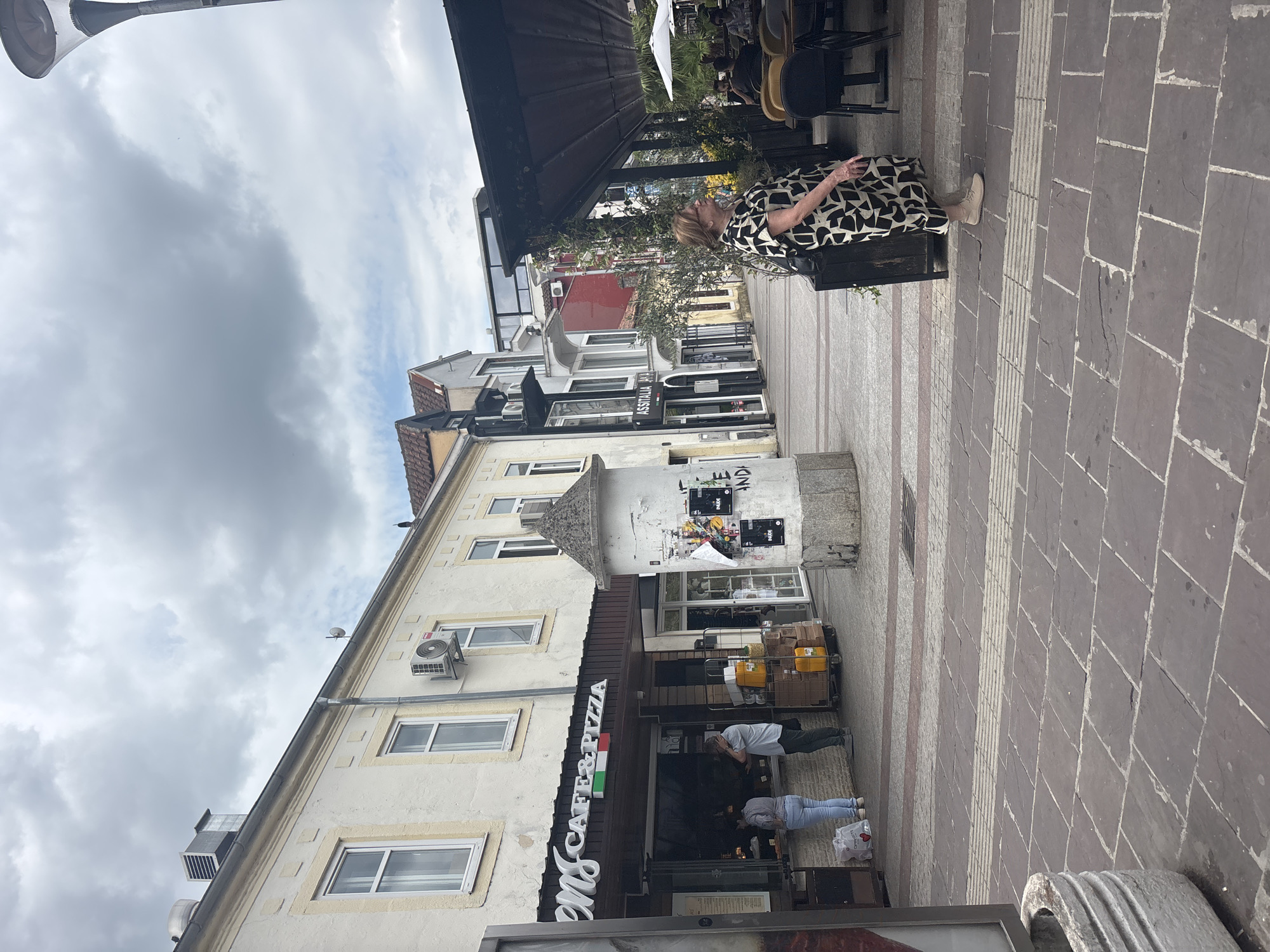 Overcast morning on Podgorica's pedestrian cafe street captured