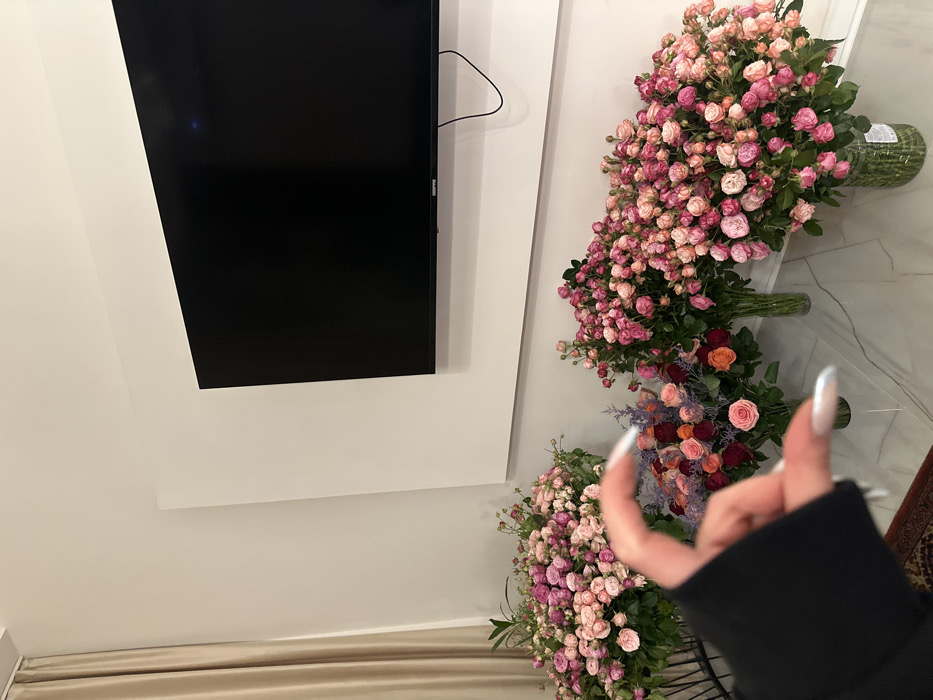 Woman Takes Selfie in Yerevan Flower Shop