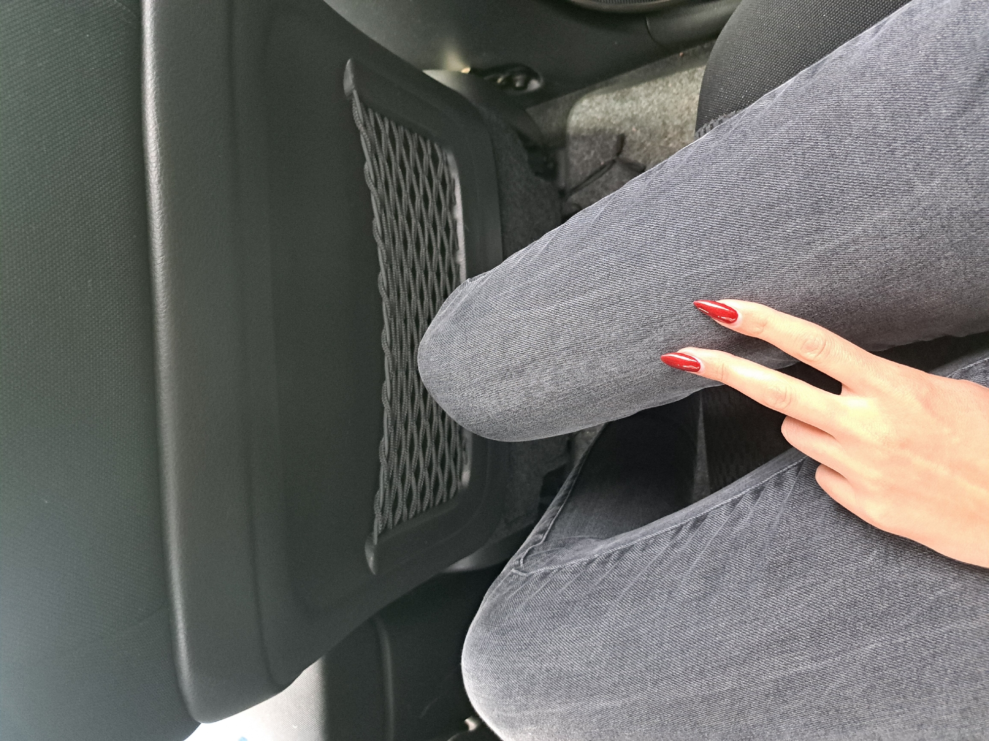 Person with red nails photographed inside car in Bulgaria