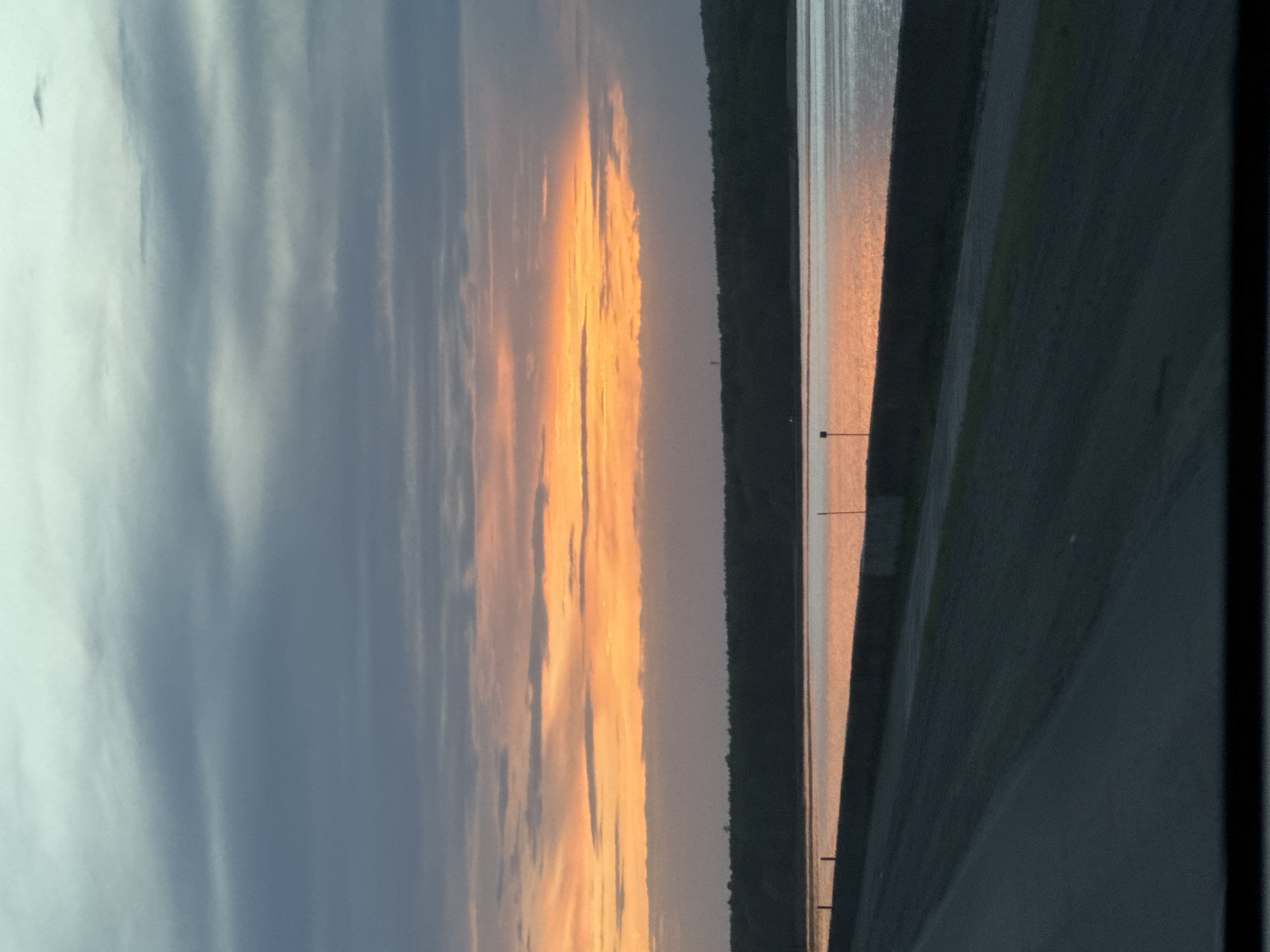 Sunset observed over water body in Chaikovsky, Russia