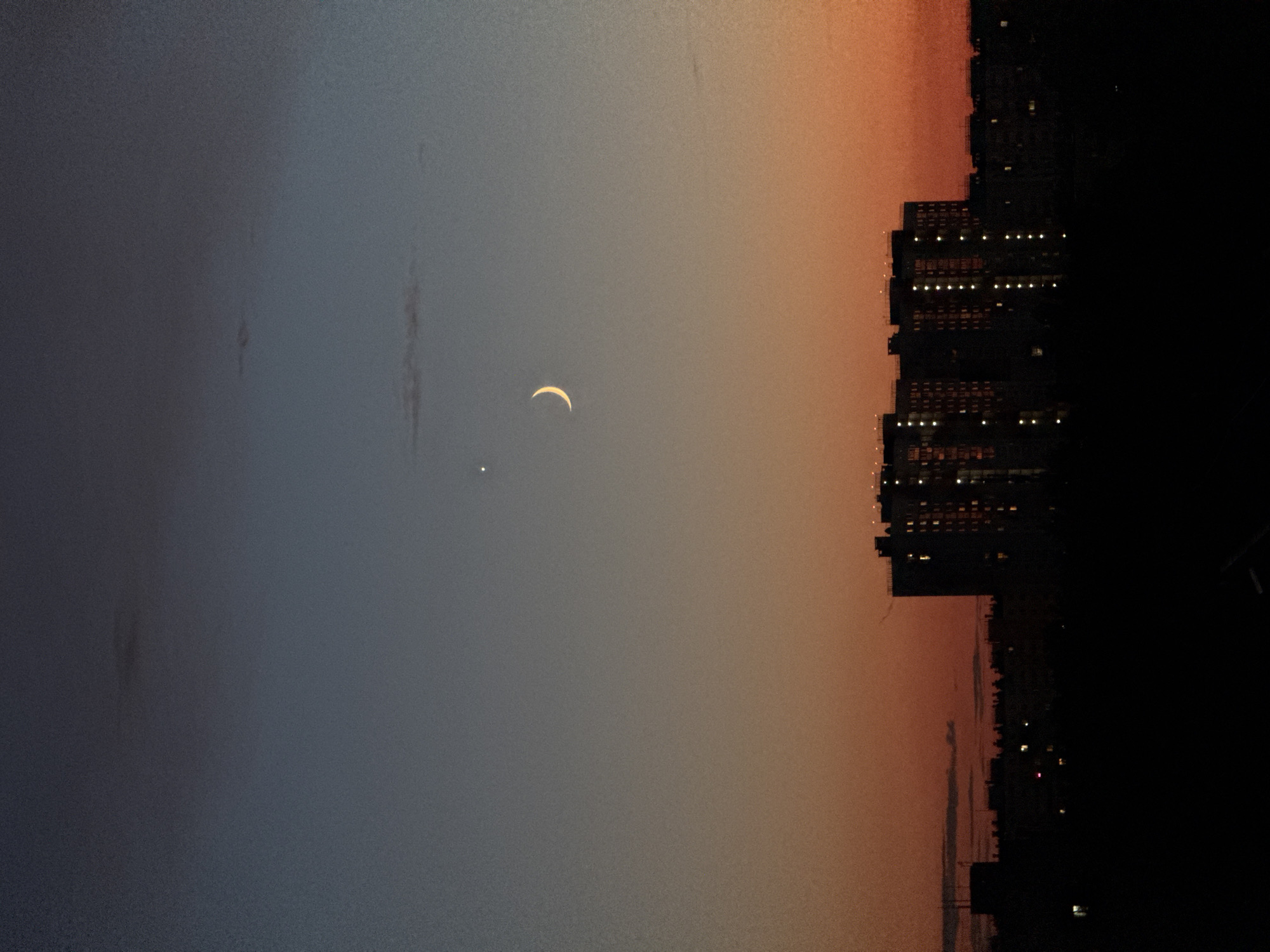 Crescent moon and Venus rise over Nizhny Novgorod at dusk