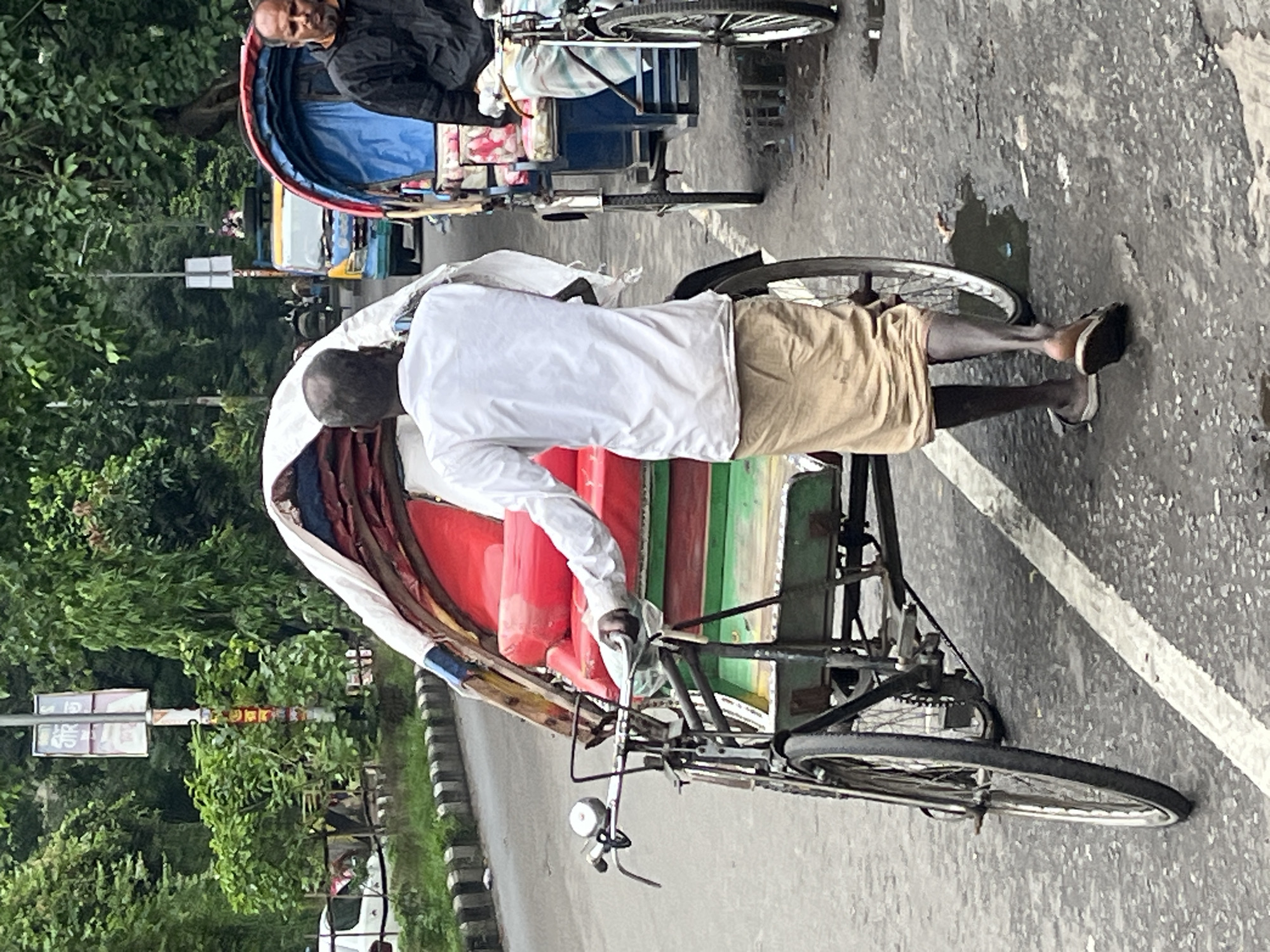 Rickshaw operator spotted on Dhaka street scene