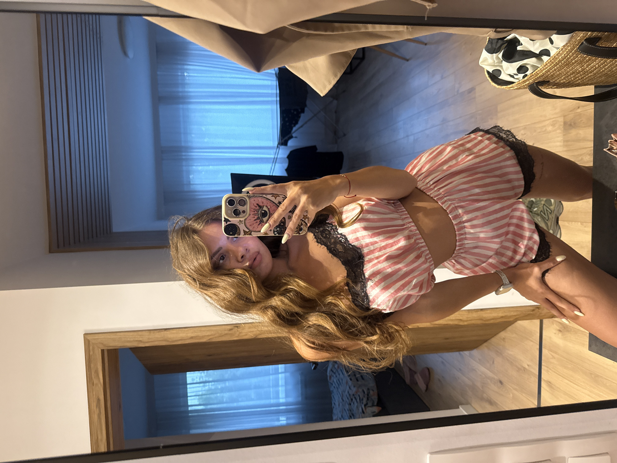 Mirror selfie series in Plovdiv bedroom, pink striped pajama set