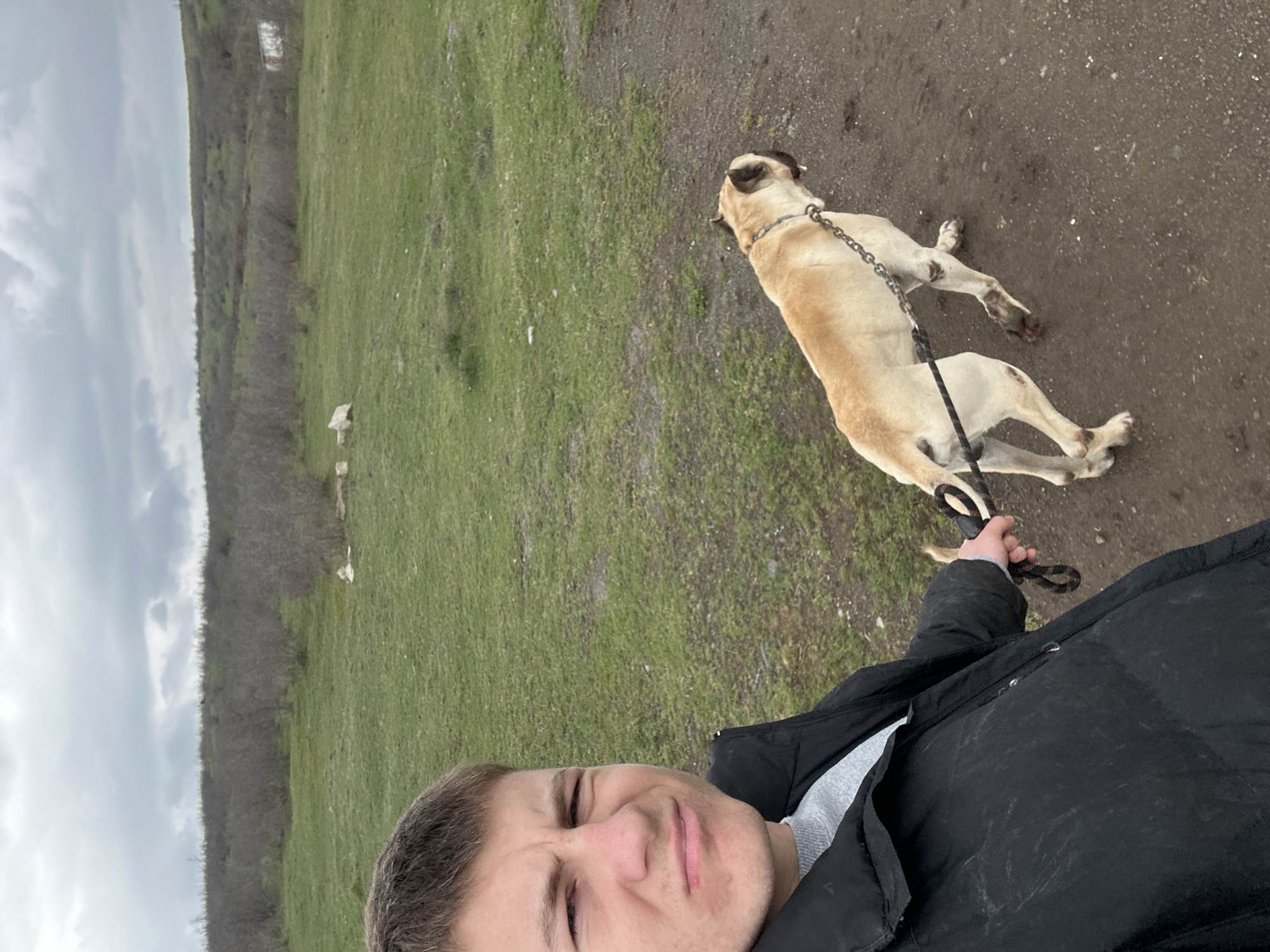 Person takes outdoor selfie with large dog in Bulgaria