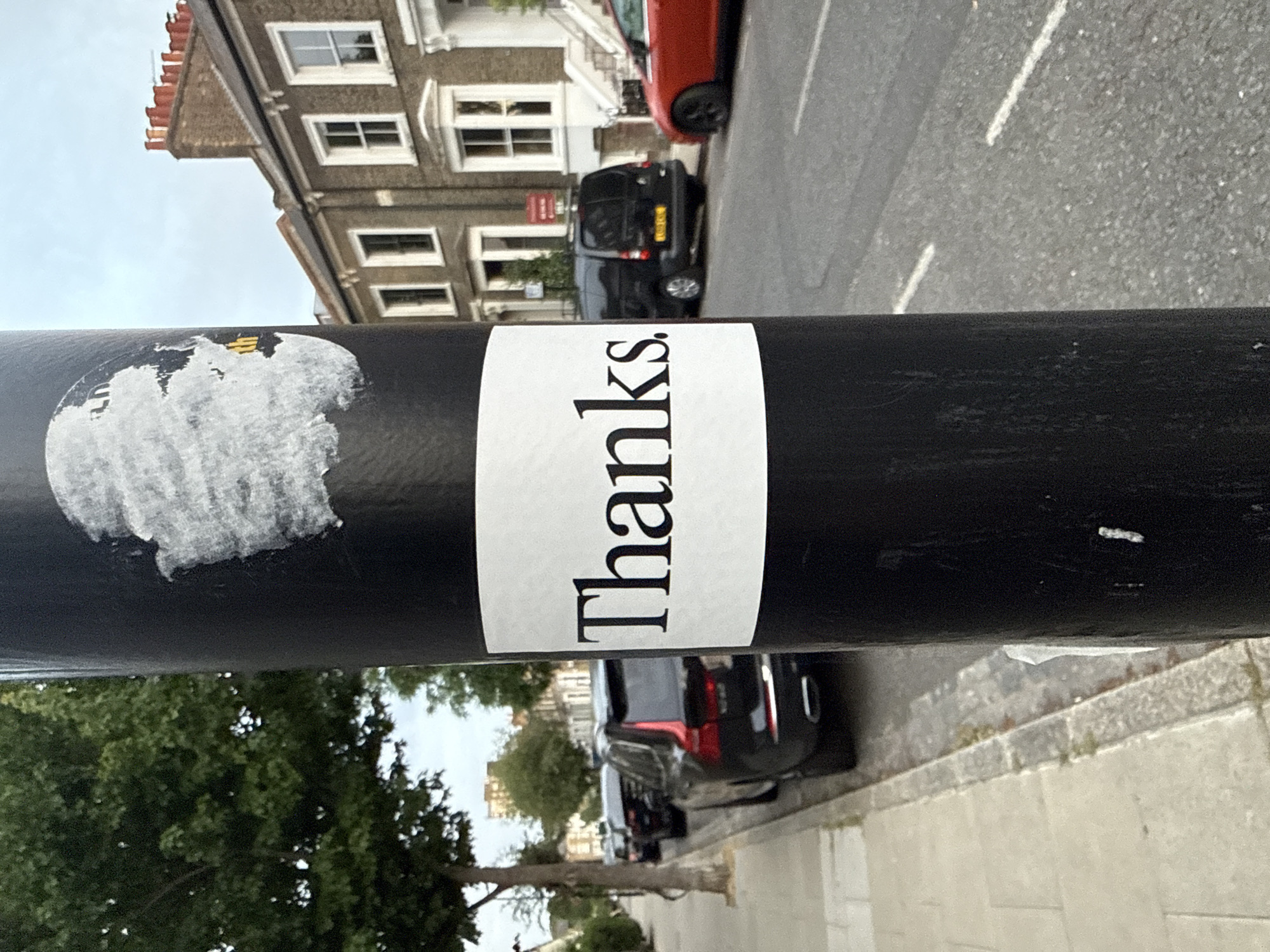 London evening captures: gratitude sticker and collared cat sighting
