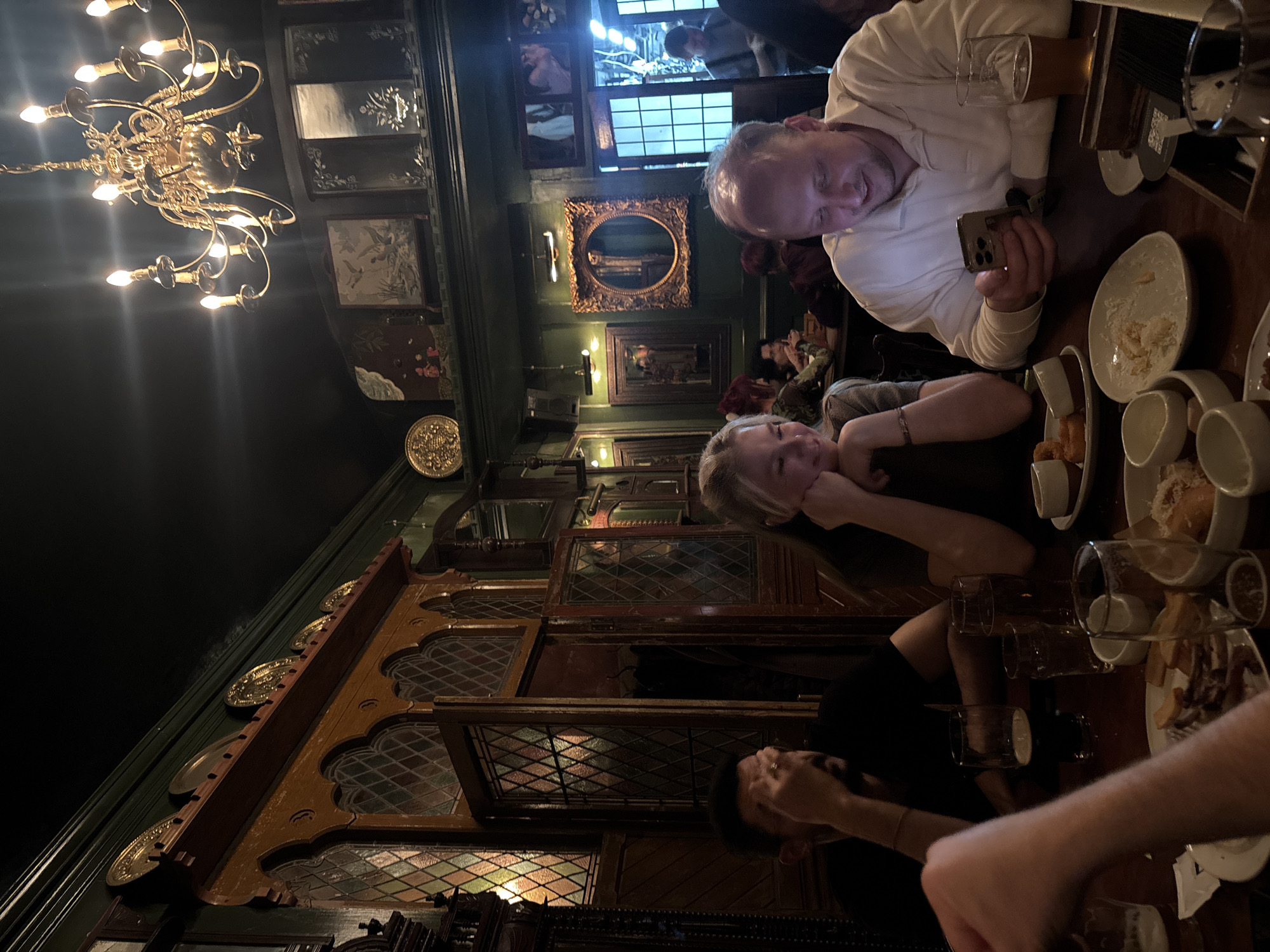 Witness captures ornate pub interior with chandelier, dark décor