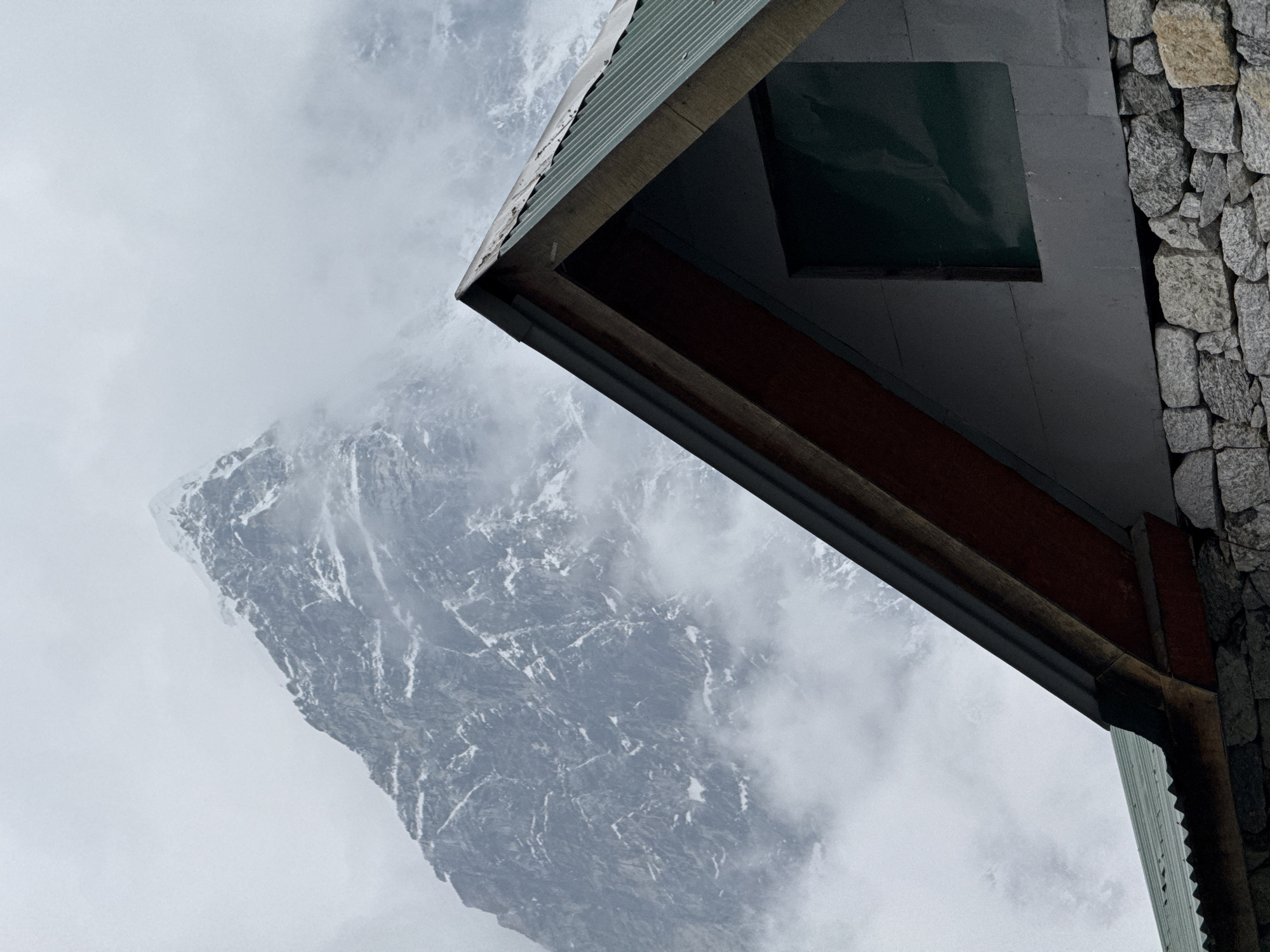 Building observed against mountain backdrop in Dughla, Nepal