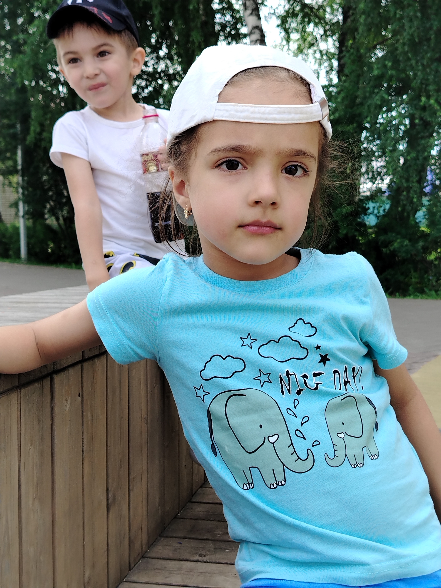 Morning at a Yanaul playground with a dinosaur sandbox centerpiece