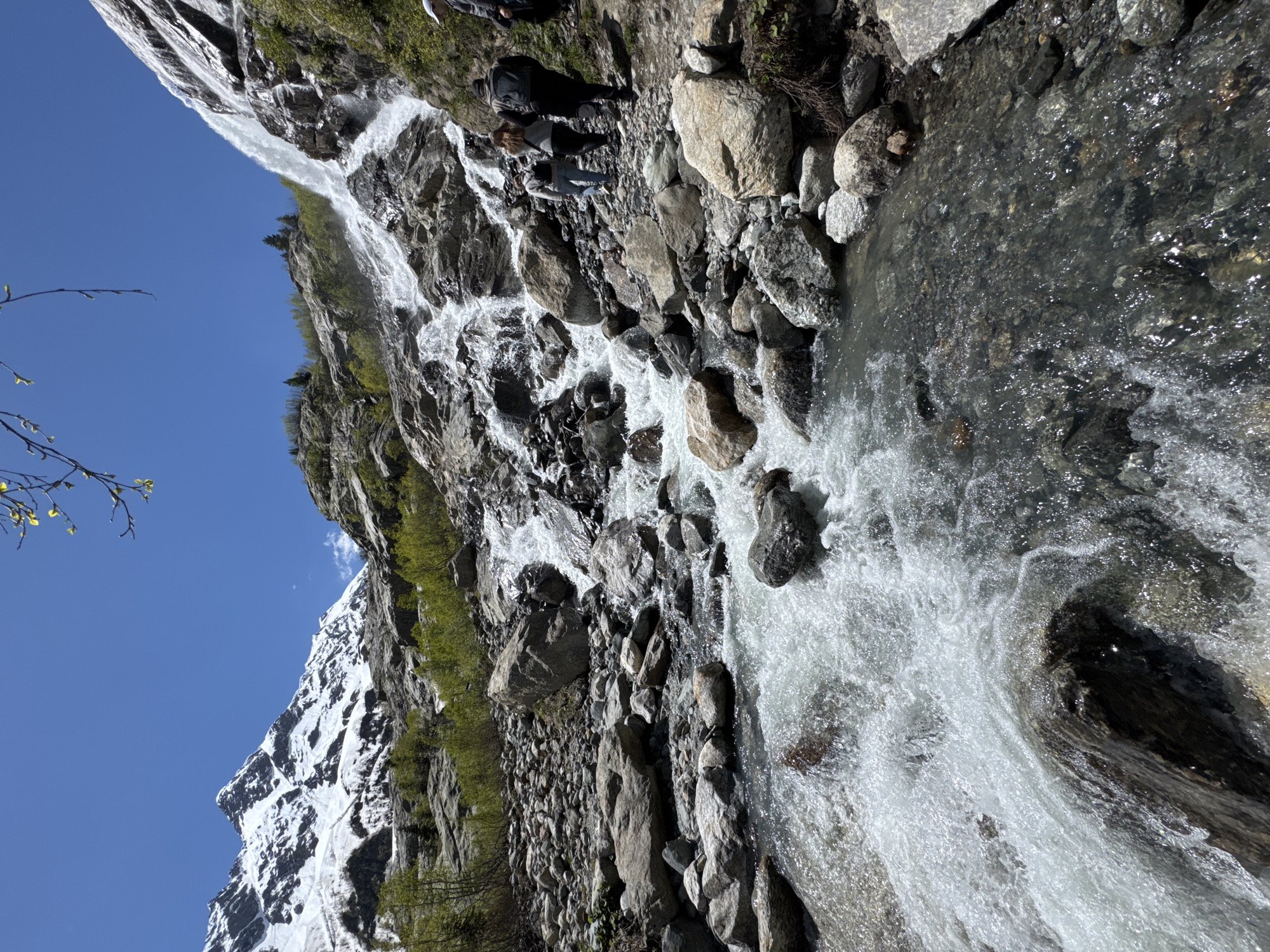 Tourists visit mountain waterfall in Russian Caucasus region