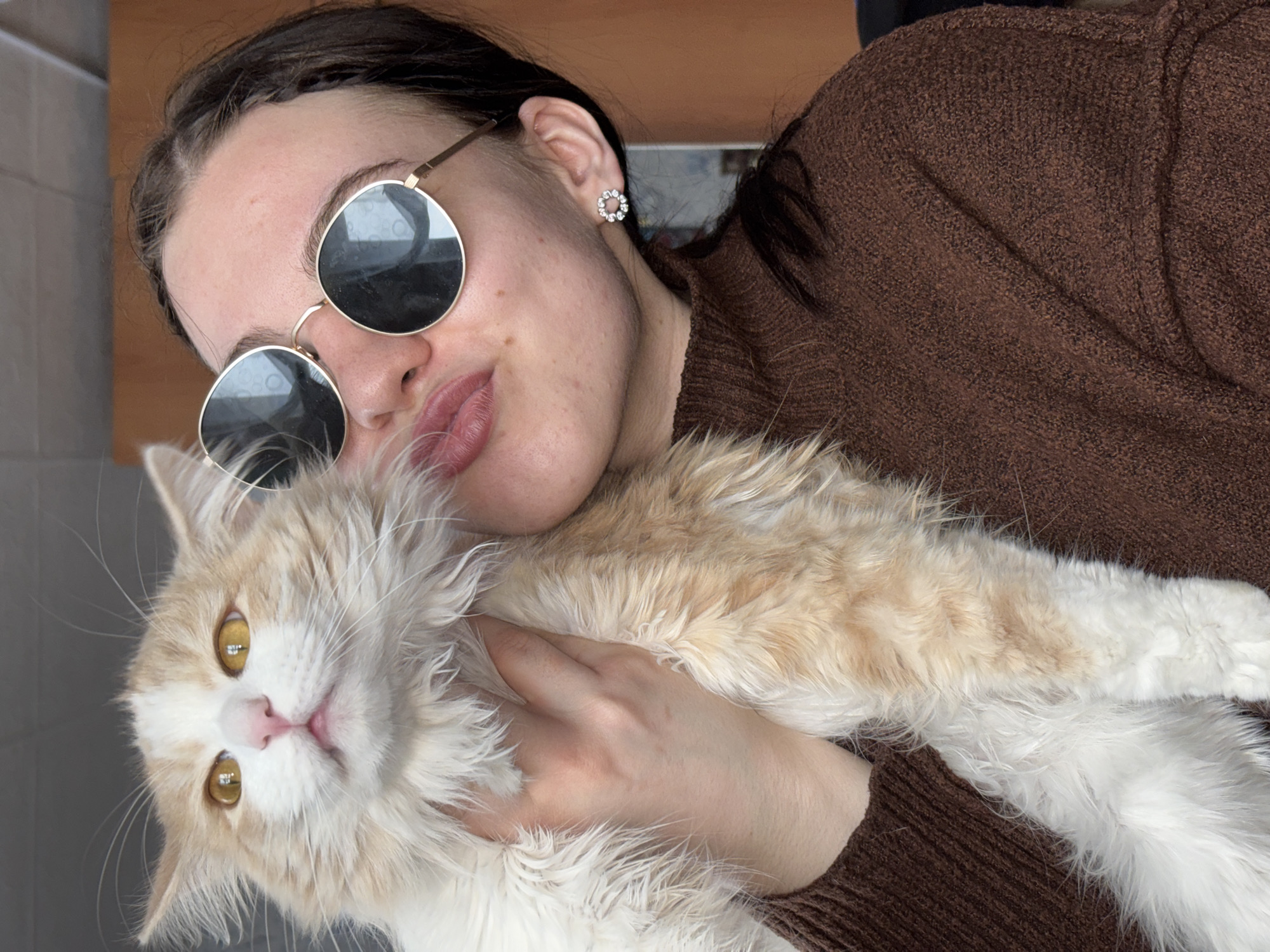 Woman with cat, phone repair captured in Zasechnyi