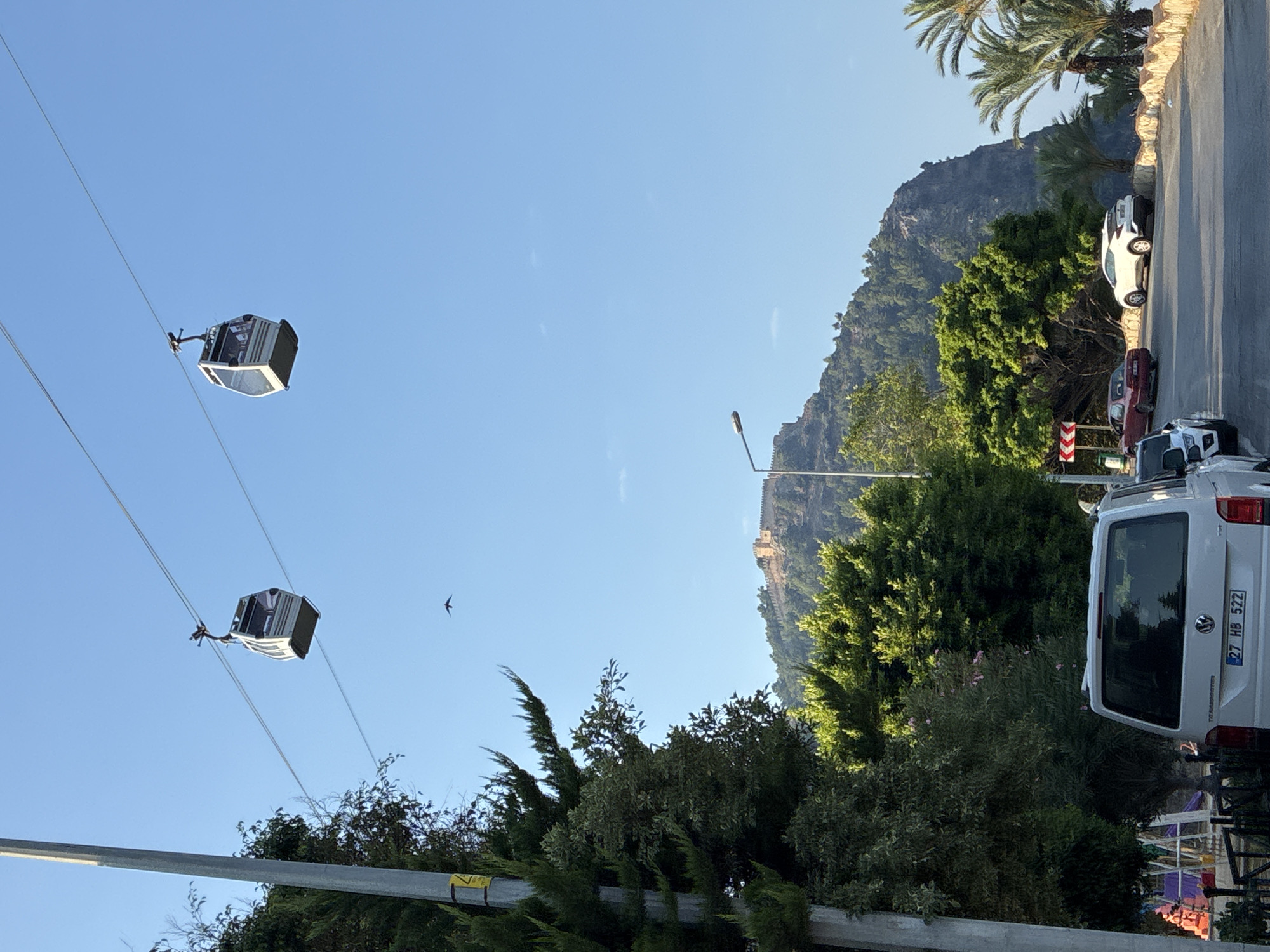 Morning views from Alanya's hilltop: cable cars, coastline, and old city
