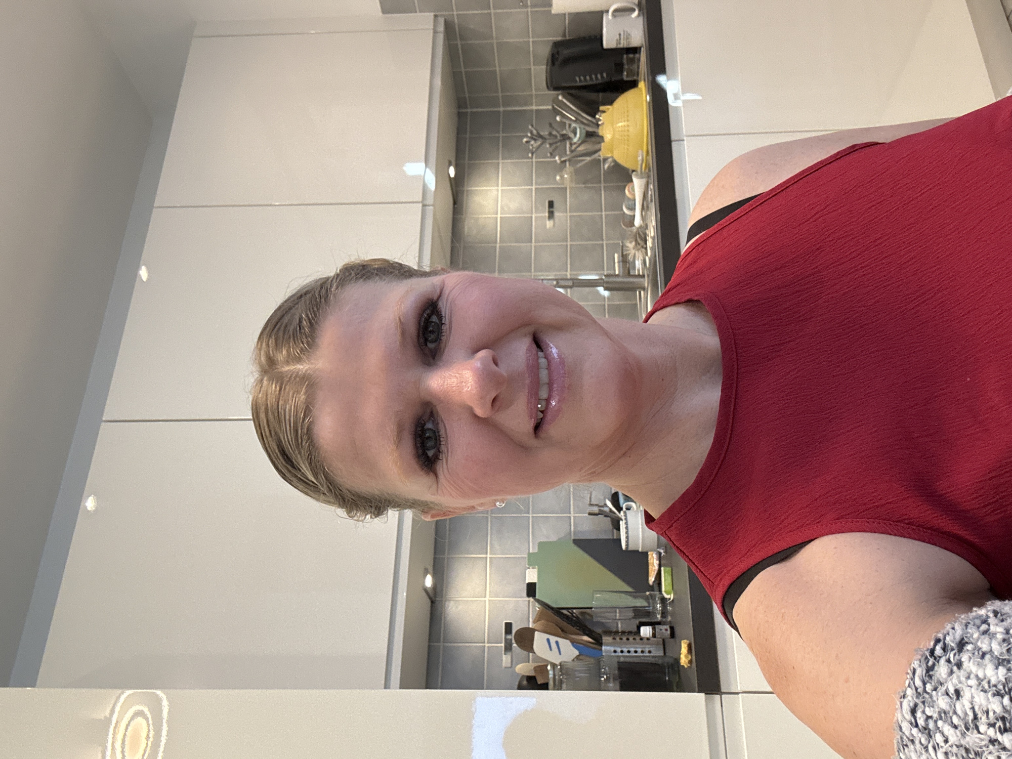 Woman takes smiling selfie in Marche-en-Famenne, Belgium