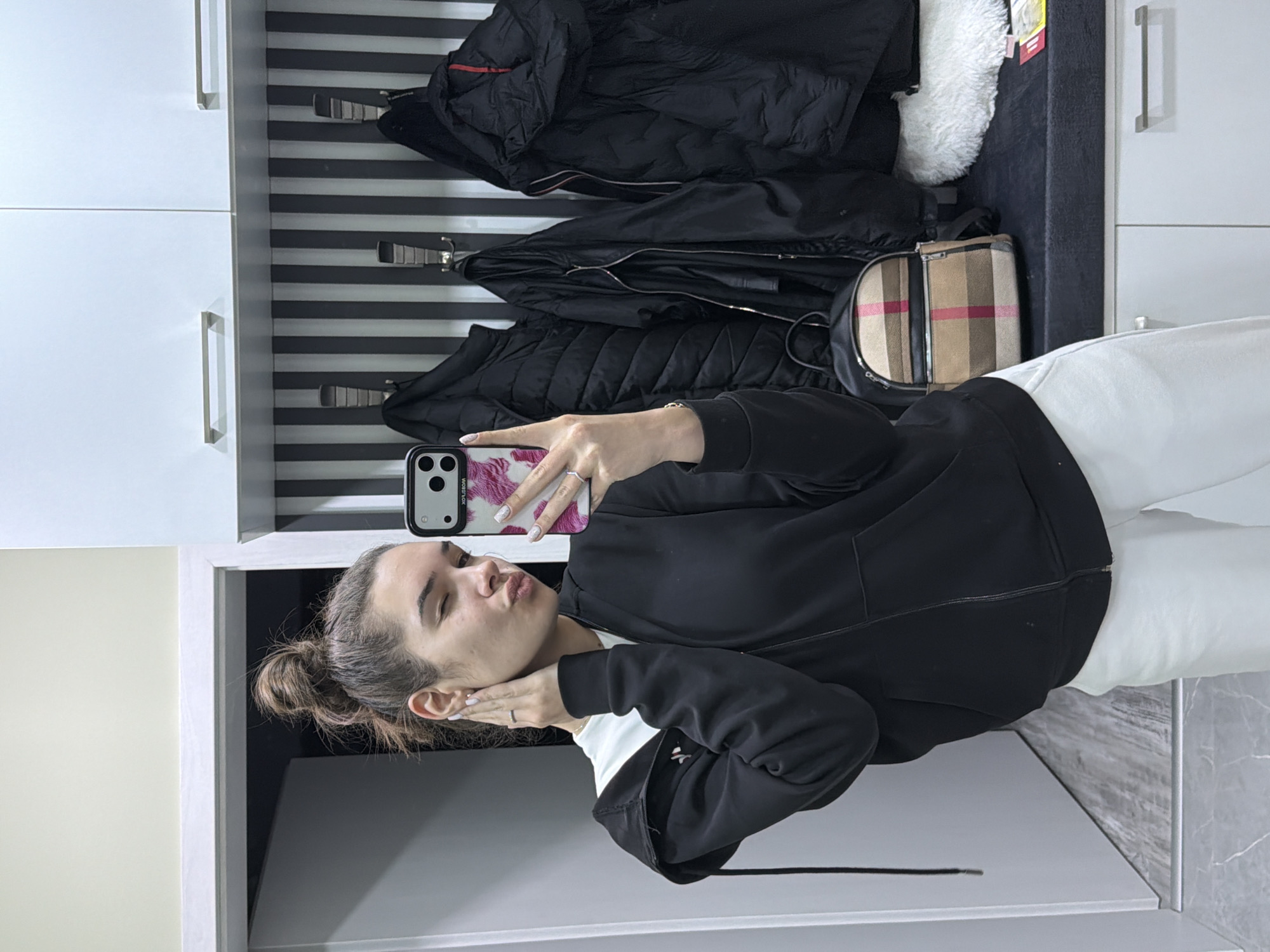 Woman takes selfies in hallway in Dobrich, Bulgaria