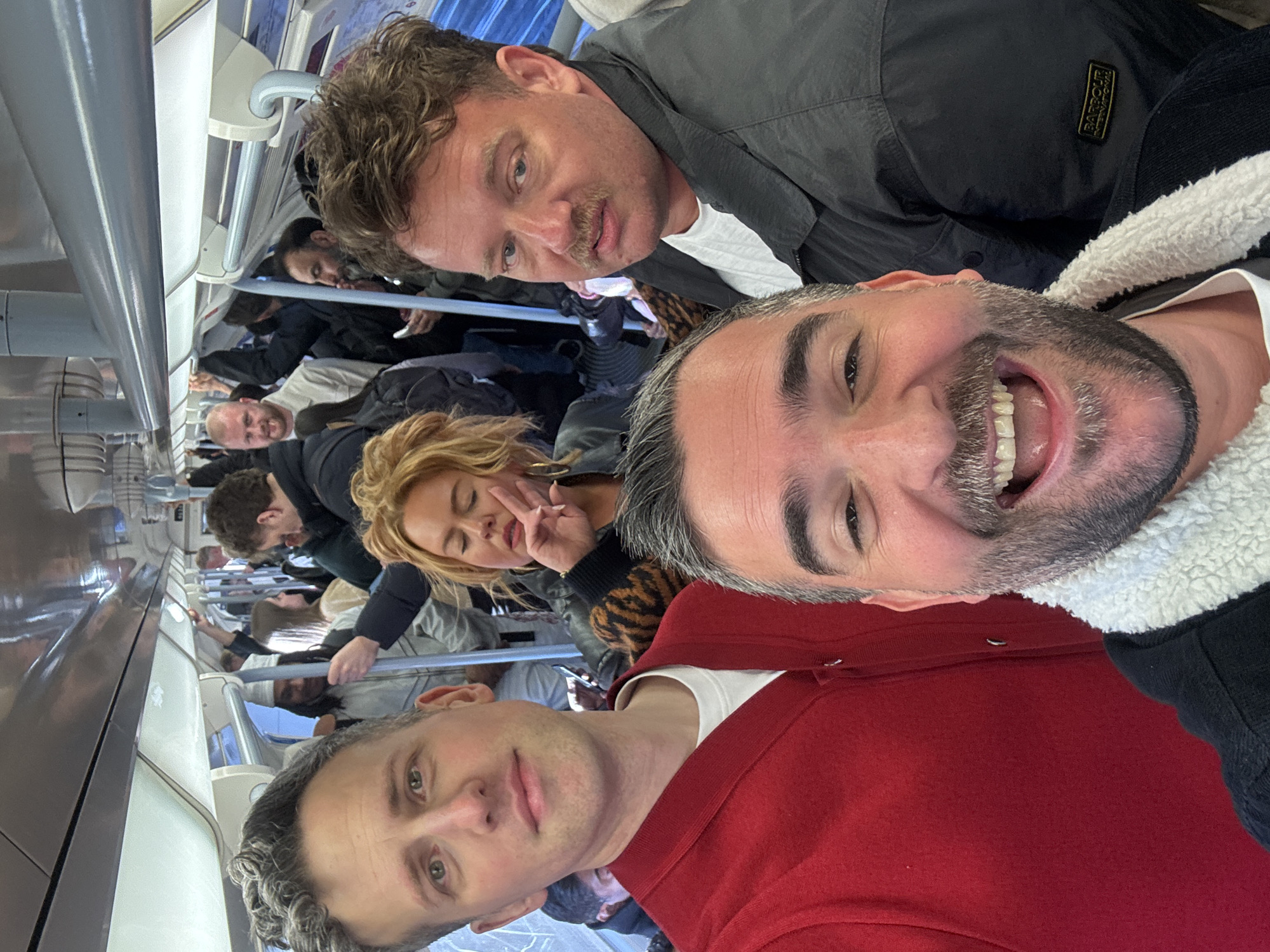 Commuters photographed on crowded London Underground train during evening rush