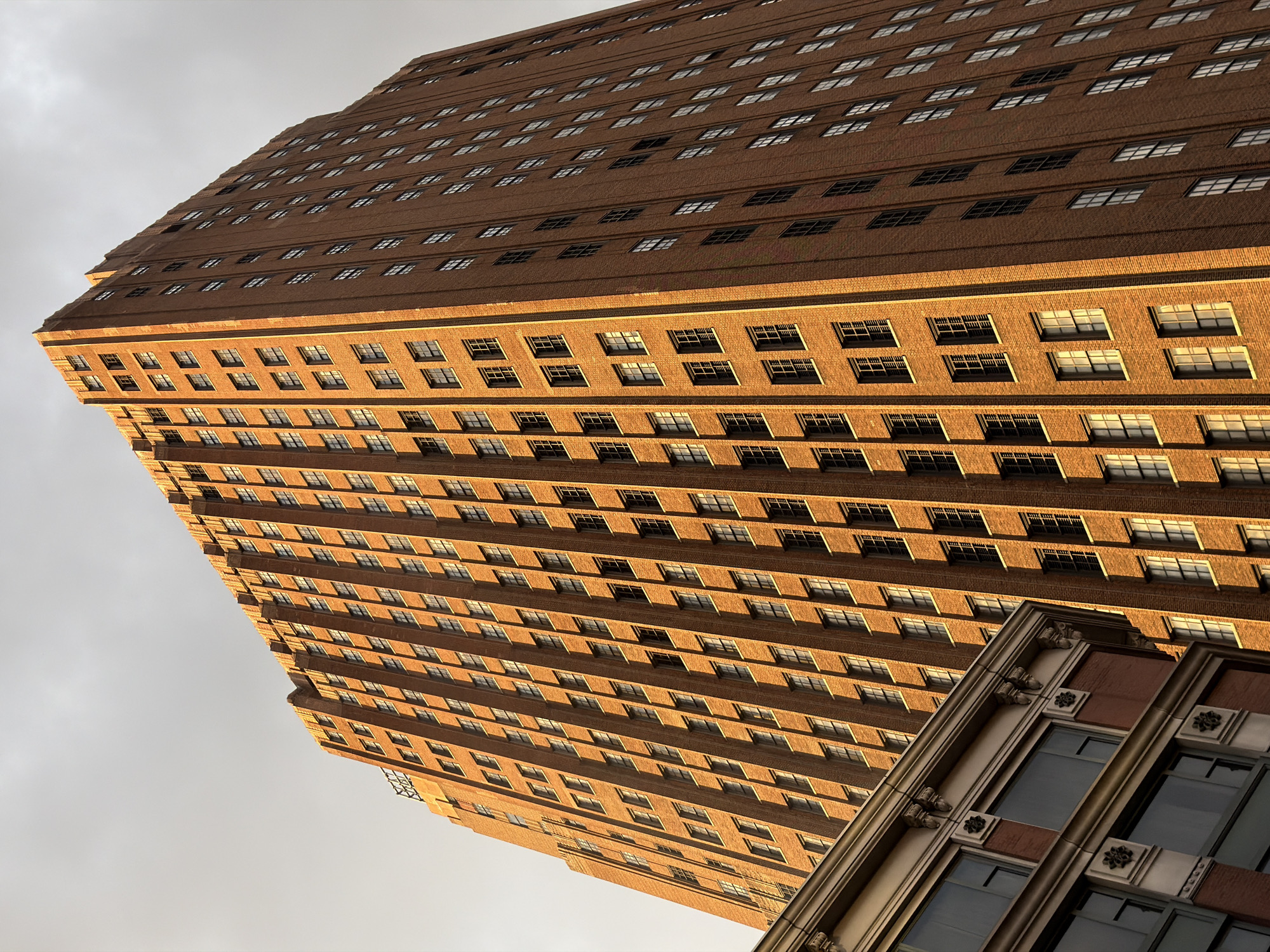 Brick building photographed from street level in NYC