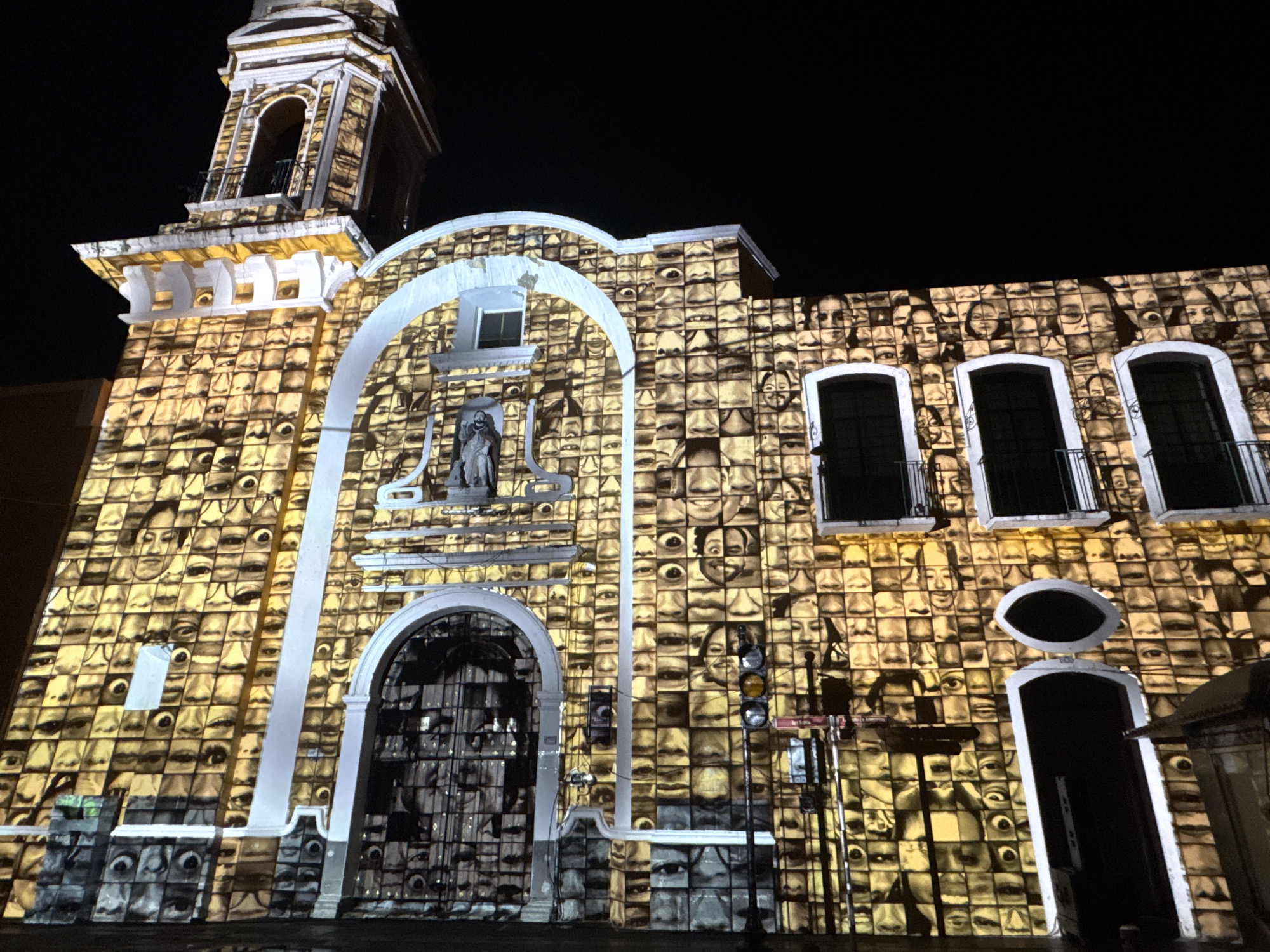 Church in Puebla illuminated with projected faces display