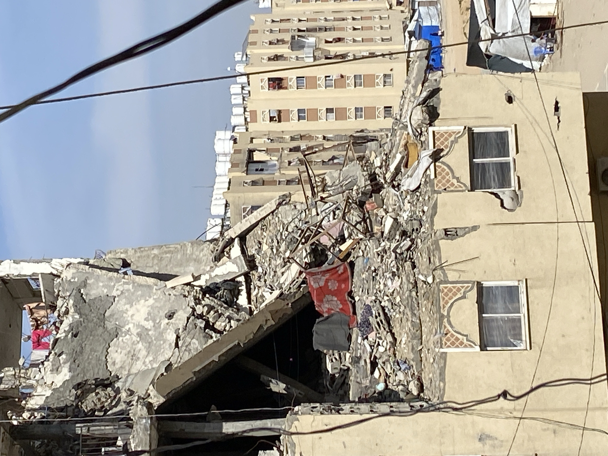 Building collapse damages apartment structure in Khan Yunis