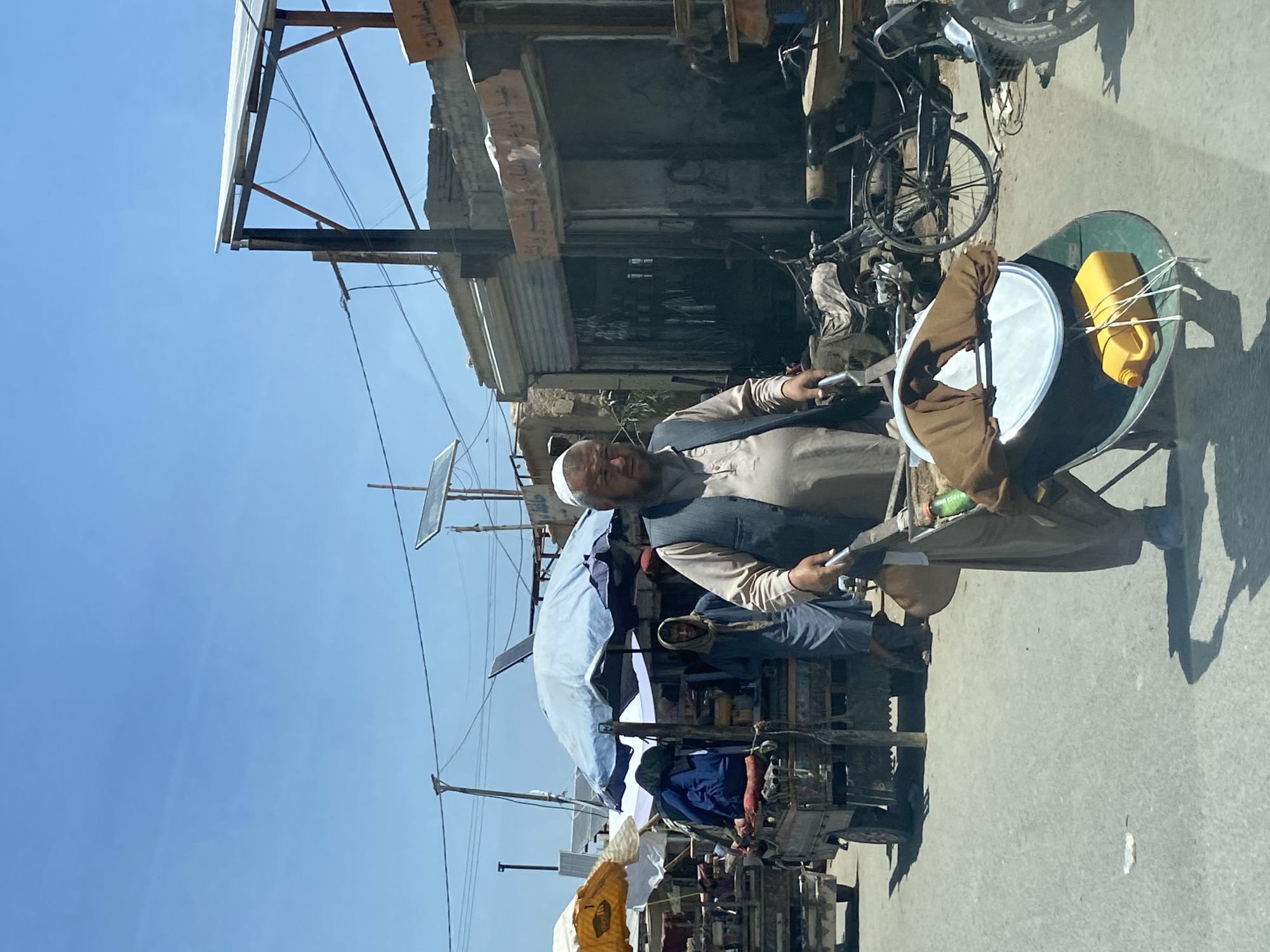 Street activity in Kandahar's commercial district on a clear morning