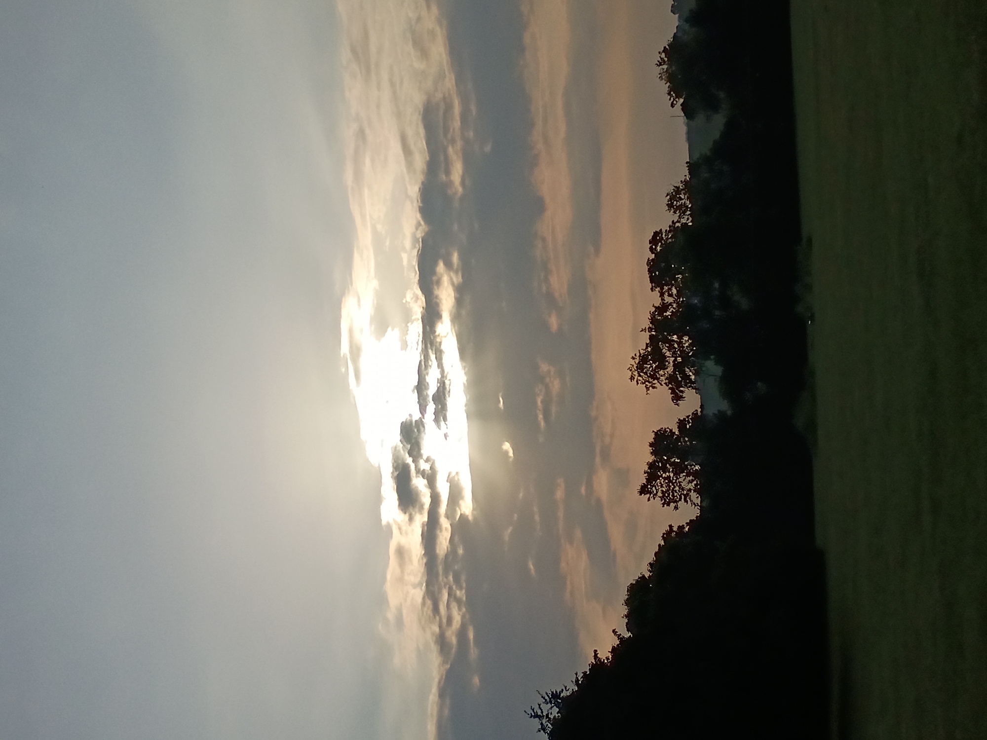 Sunbeams breaking through clouds over Frankfort, Kentucky